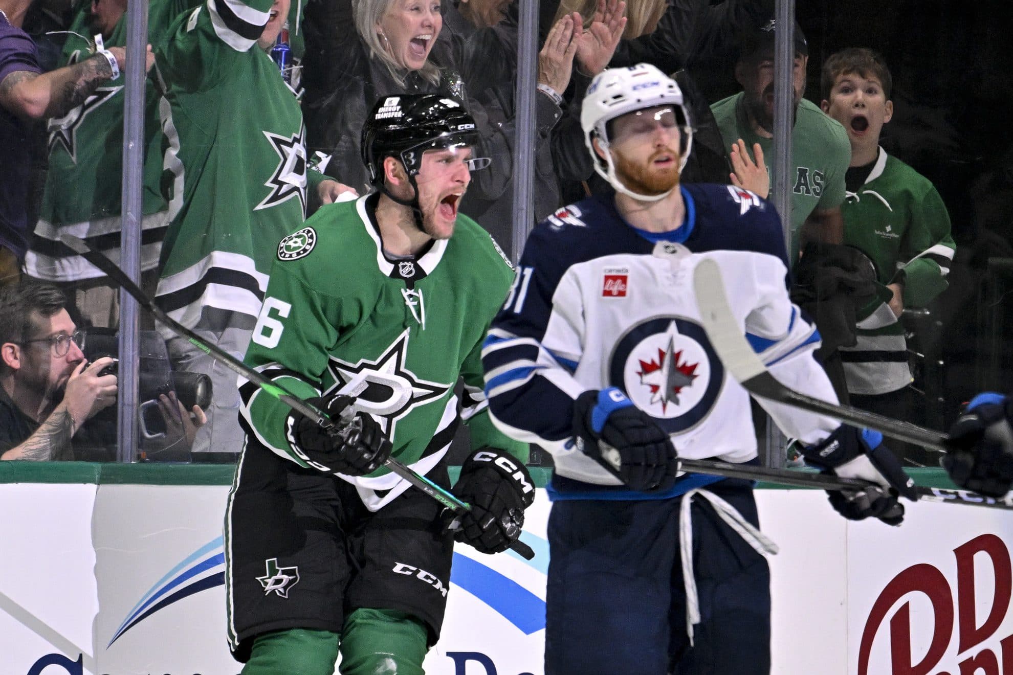 Dallas Stars right wing Mikko Rantanen (96) celebrates scoring a goal as Winnipeg Jets left wing Kyle Connor (81) looks on during the third period in game three of the second round of the 2025 Stanley Cup Playoffs at American Airlines Center.
