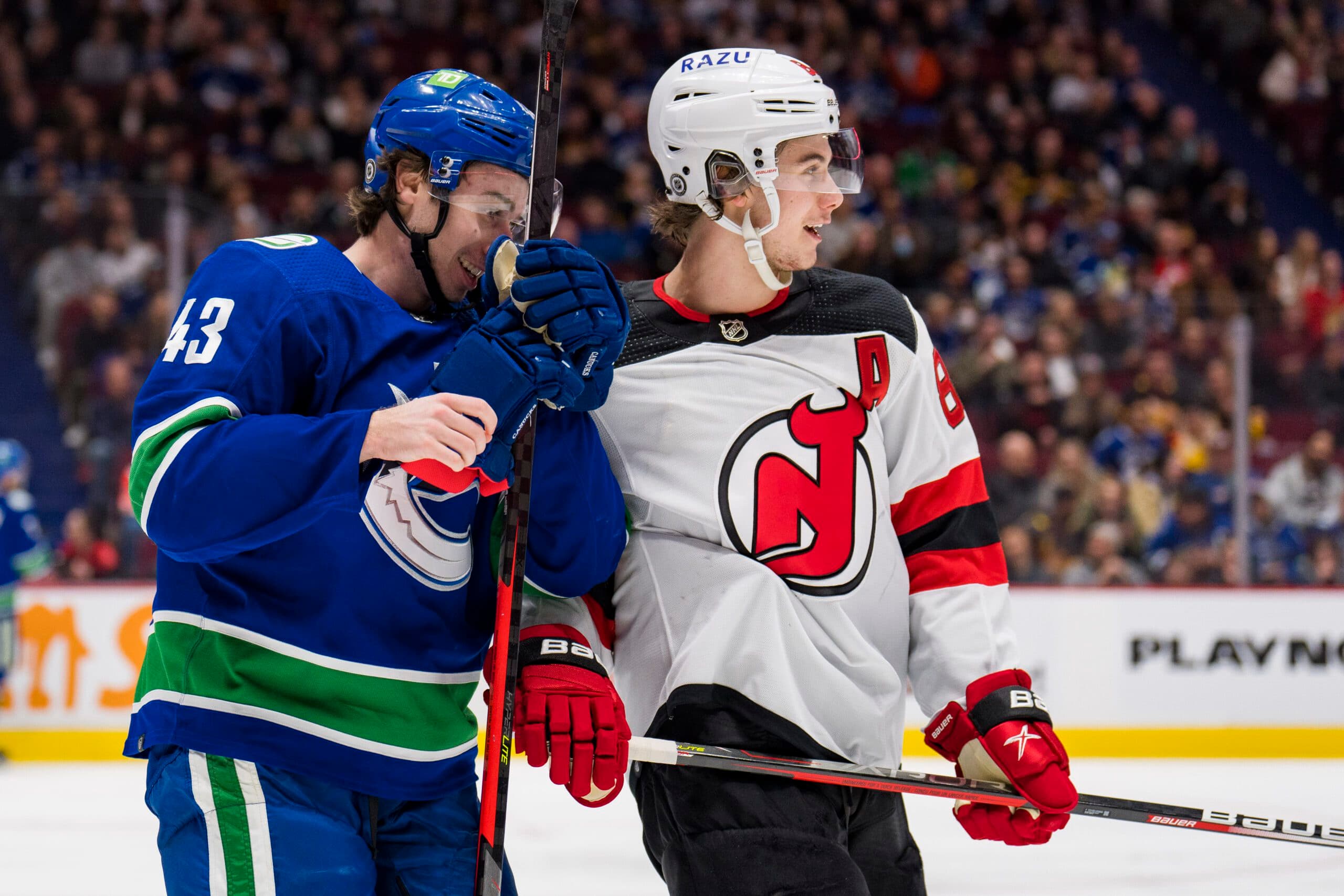 Quinn Hughes and Jack Hughes