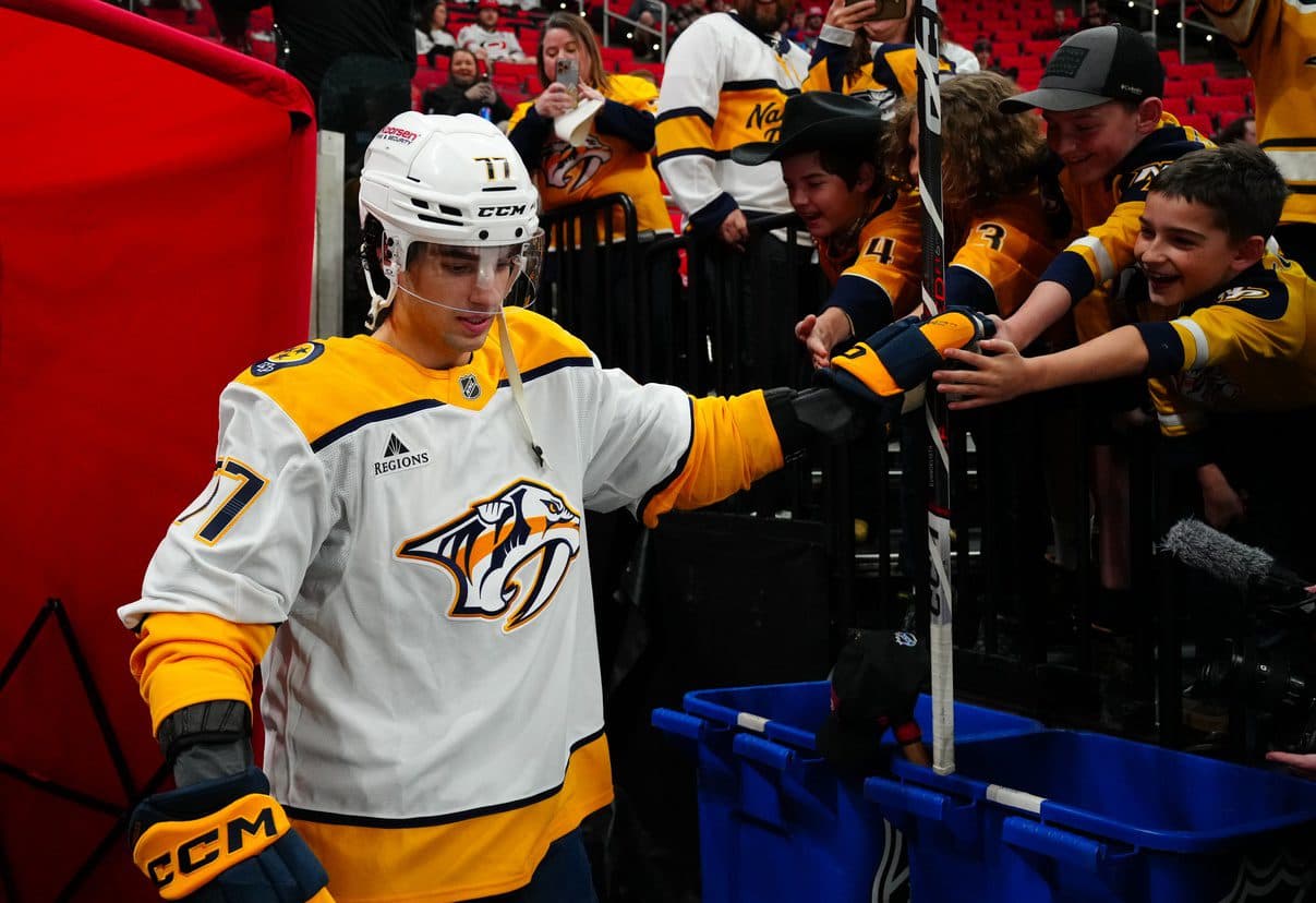 Nashville Predators right wing Luke Evangelista (77) goes past the fans on his way to the ice for the the warmups before the game against the Carolina Hurricanes at Lenovo Center.