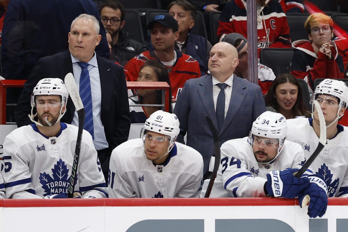 Toronto Maple Leafs head coach Craig Berube (L) and assistant coach Derek Lalonde (R) look on from behind the bench against the Washington Capitals during the second period at Capital One Arena.