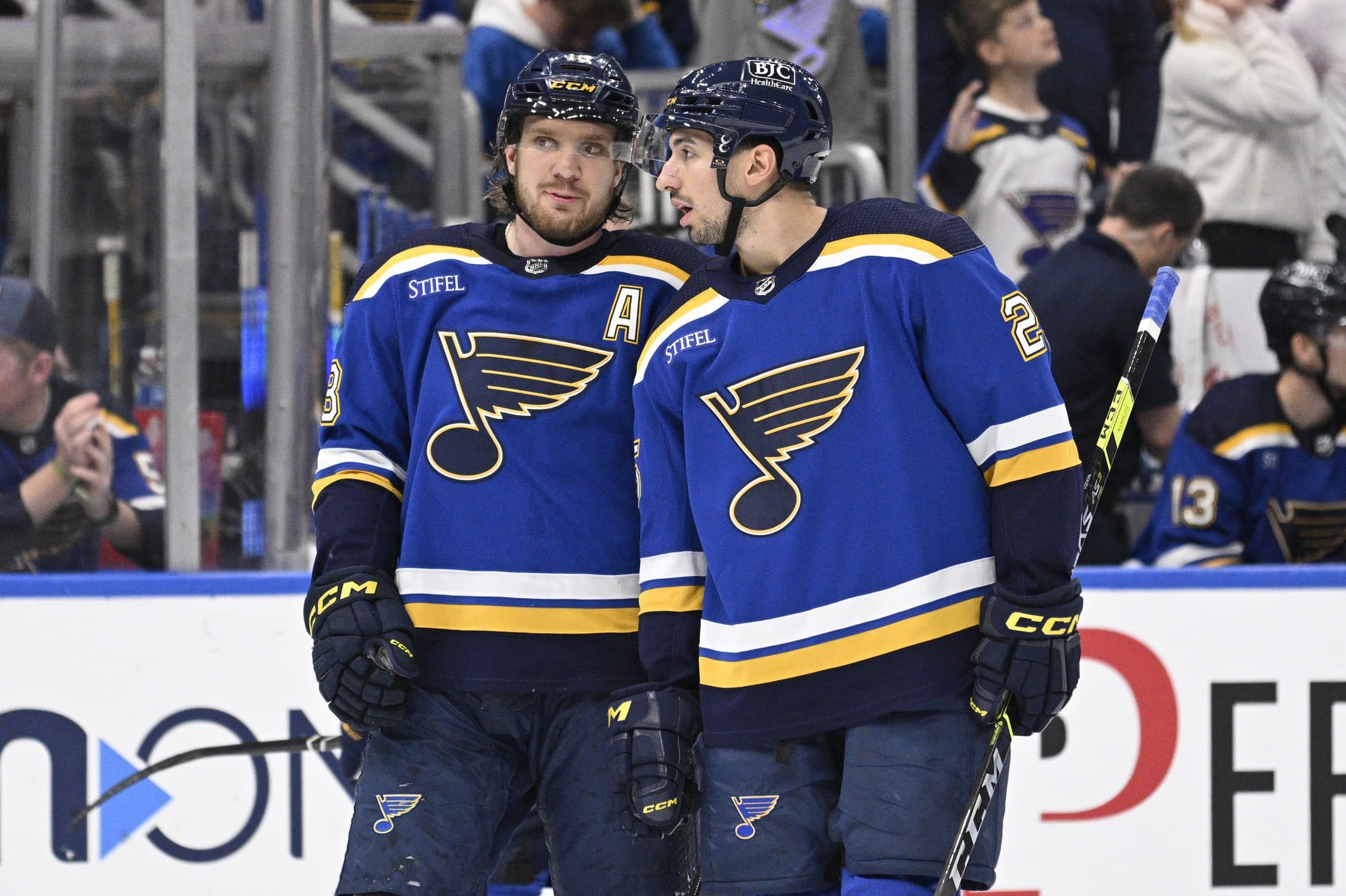 St. Louis Blues center Jordan Kyrou (25) talks with center Robert Thomas (18) during the second period of a hockey game against the Edmonton Oilers at Enterprise Center.