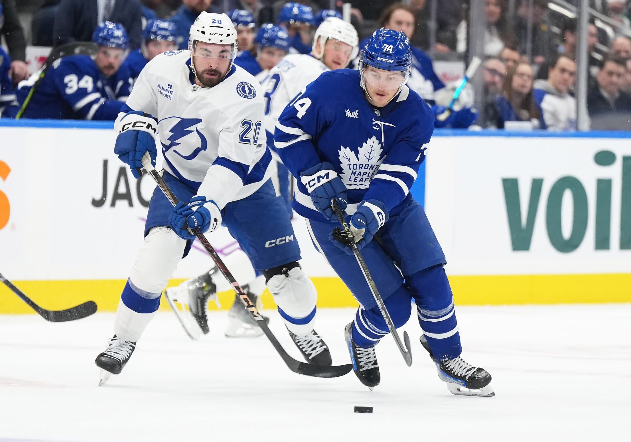 Toronto Maple Leafs center Bobby McMann (74) skates with the puck as Tampa Bay Lightning left wing Nick Paul (20) gives chase during the second period at Scotiabank Arena.