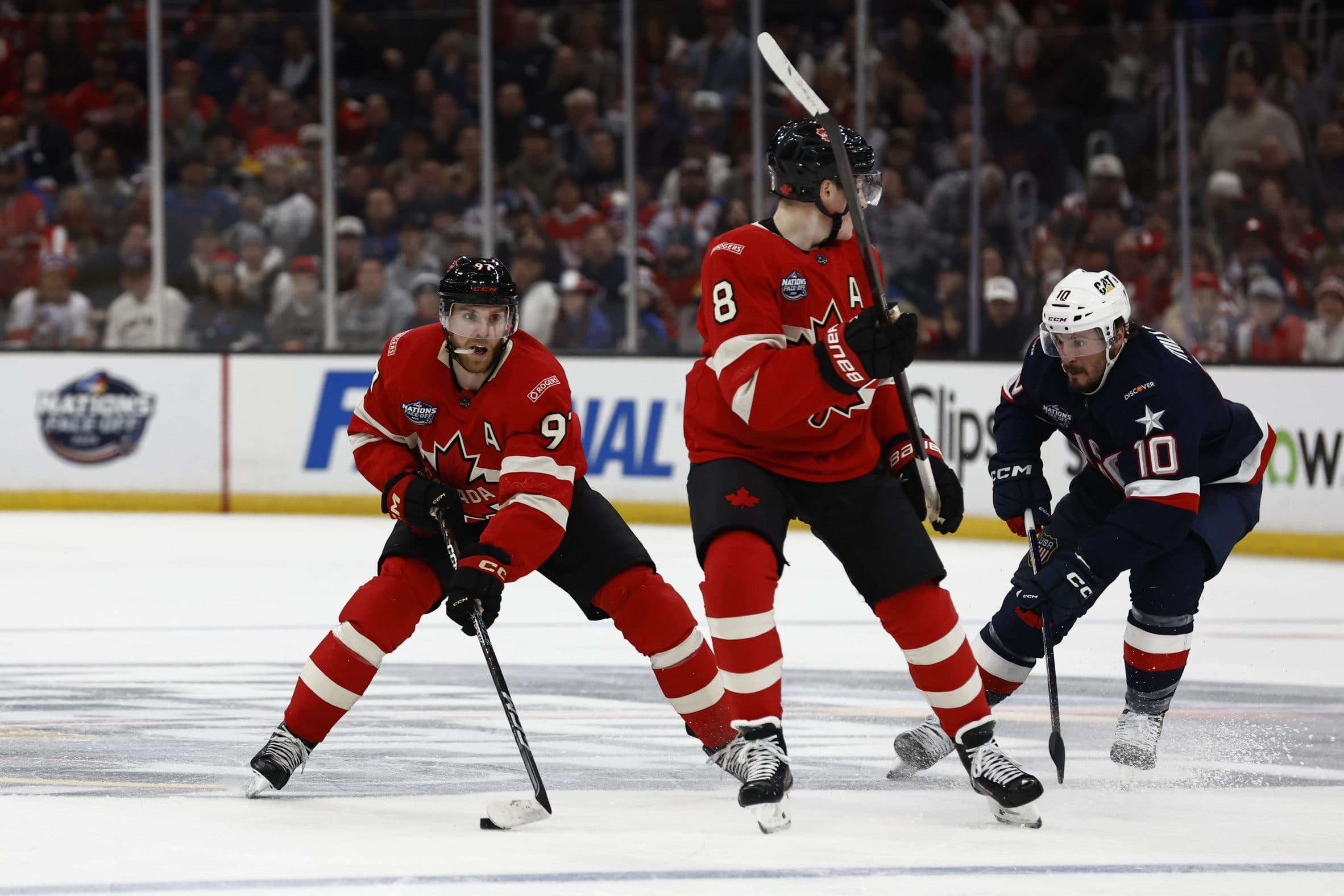 Team Canada forward Connor McDavid (97) controls the puck during the second period against Team USA forward J.T. Miller (10) during the 4 Nations Face-Off ice hockey championship game at TD Garden.