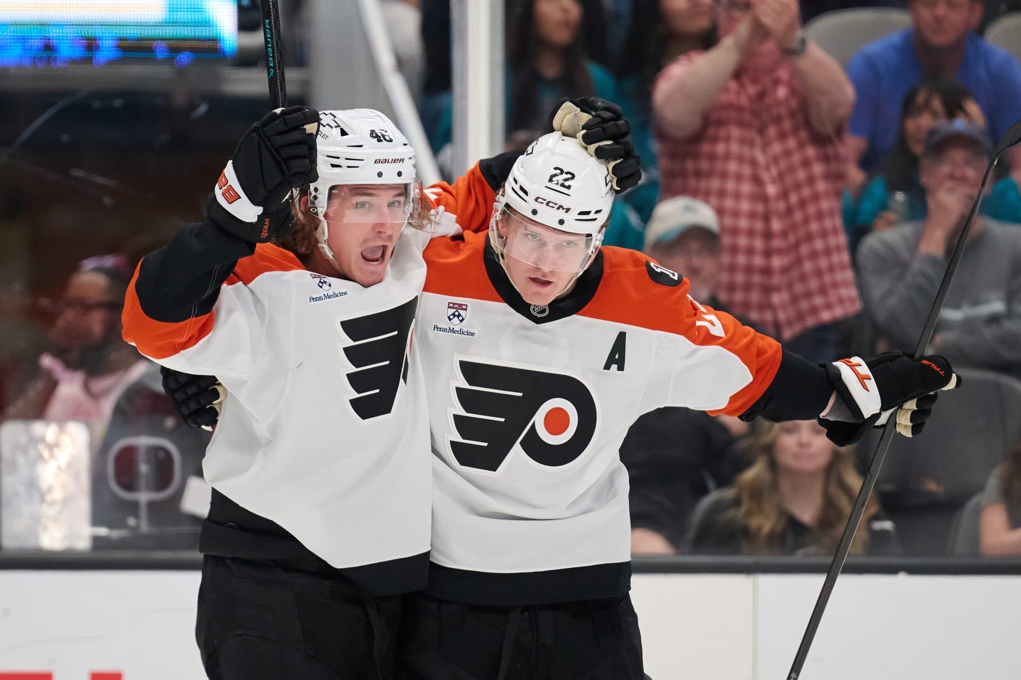 Philadelphia Flyers center Christian Dvorak (22) celebrates with center Trevor Zegras (46) after scoring the eventual game-winning goal against the San Jose Sharks during the third period at SAP Center at San Jose.