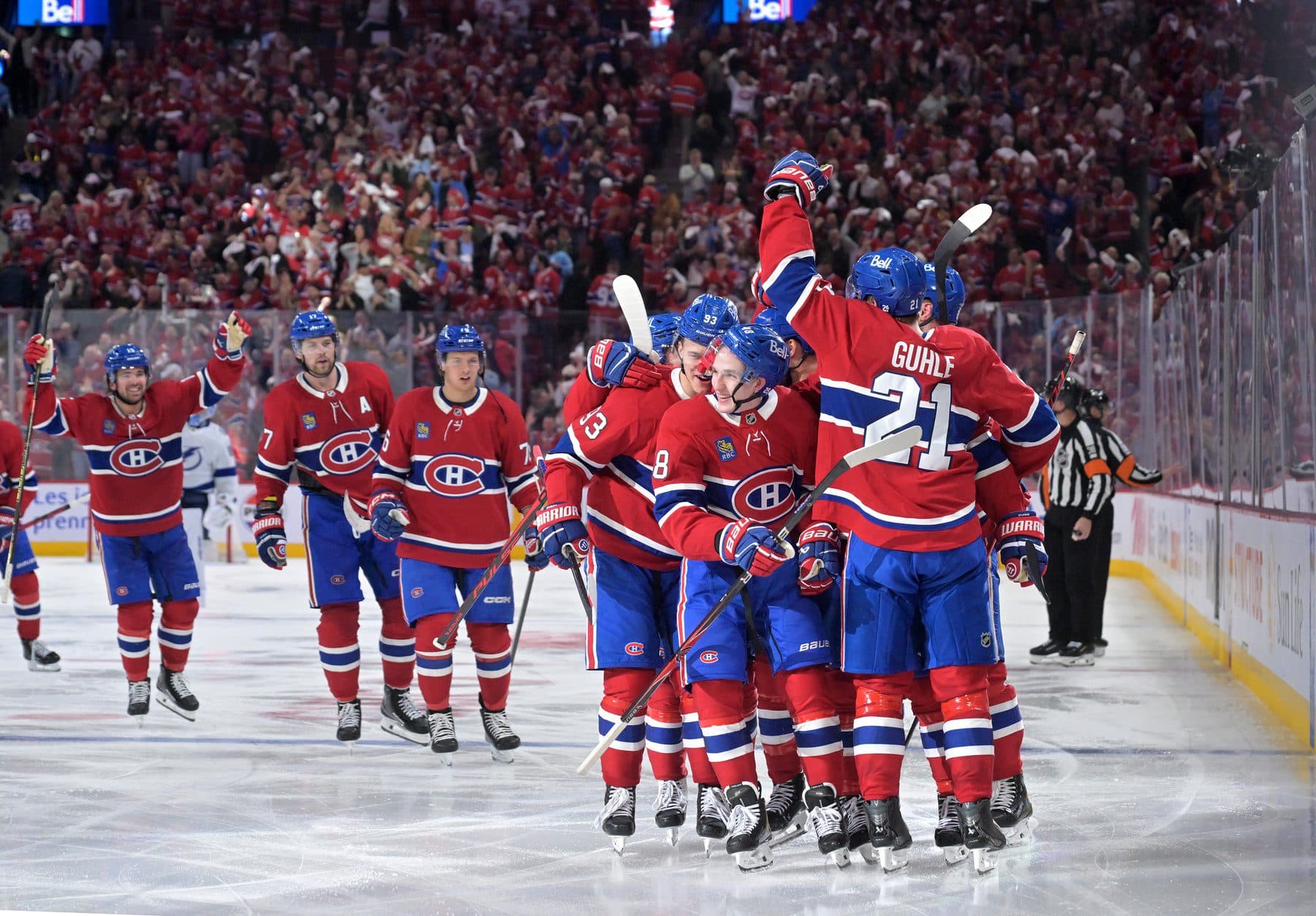 Montreal Canadiens defenseman Lane Hutson (48) celebrates with teammates after scoring the winning goal against the Tampa Bay Lightning during the overtime period in game three of the first round of the 2026 Stanley Cup Playoffs at the Bell Centre.