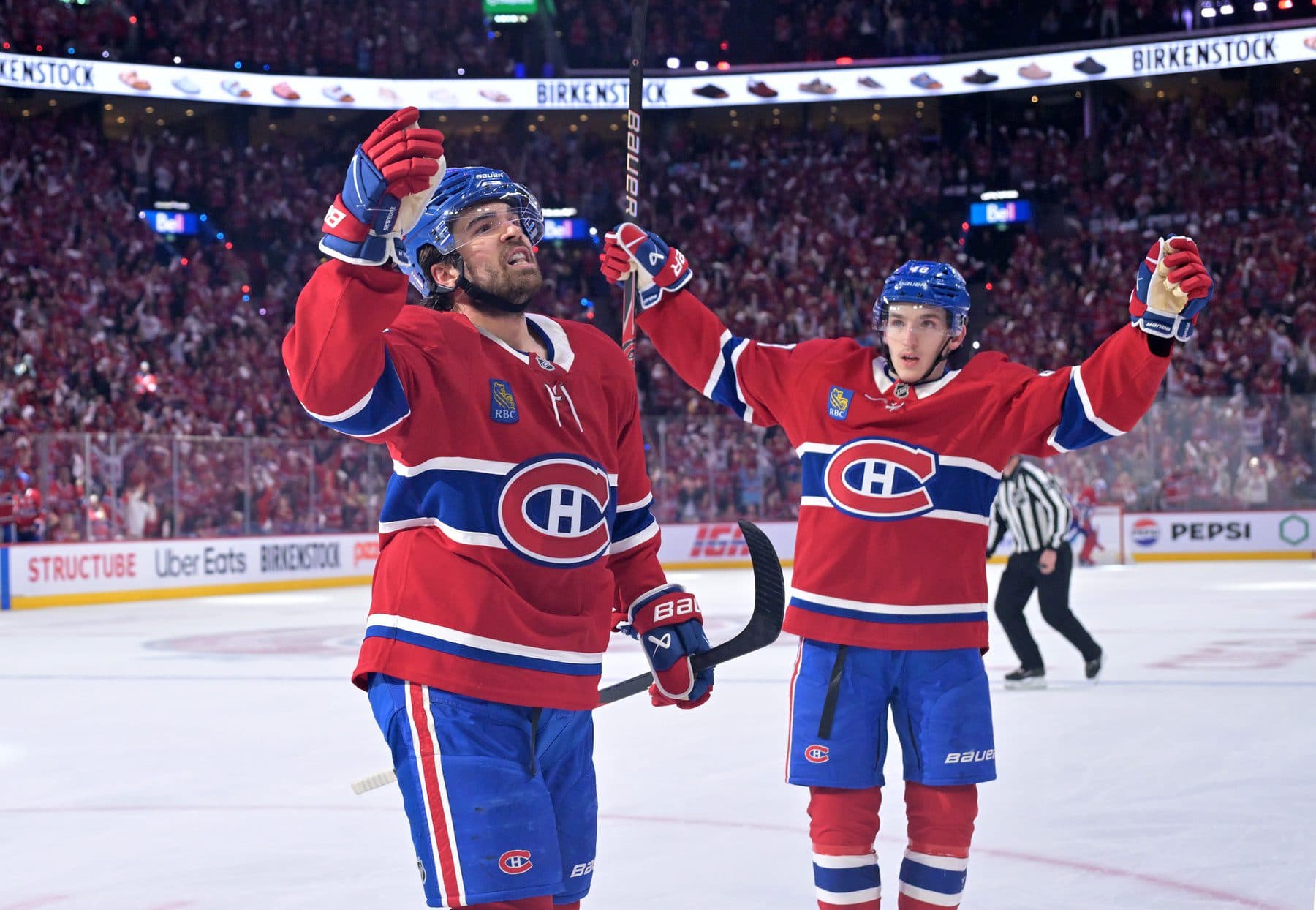 Montreal Canadiens forward Alex Newhook (15) celebrates with teammate defenseman Lane Hutson (48) after scoring a goal against the Buffalo Sabresduring the first period in game three of the second round of the 2026 Stanley Cup Playoffs at the Bell Centre.