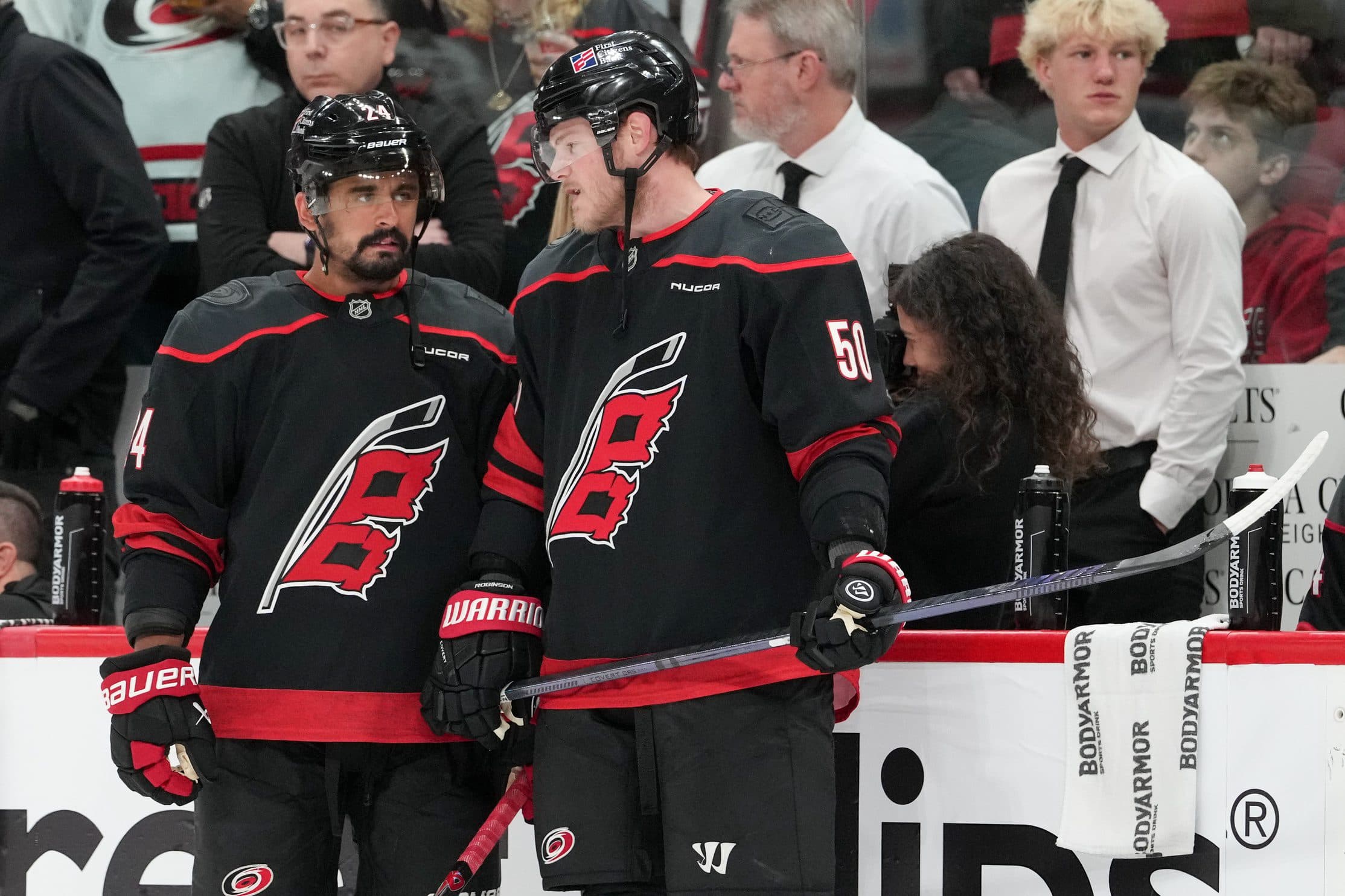 Carolina Hurricanes center Seth Jarvis (24) and left wing Eric Robinson (50) speak during warmups before game one of the Eastern Conferene Final against the Montreal Canadiens of the 2026 Stanley Cup Playoffs at Lenovo Center.