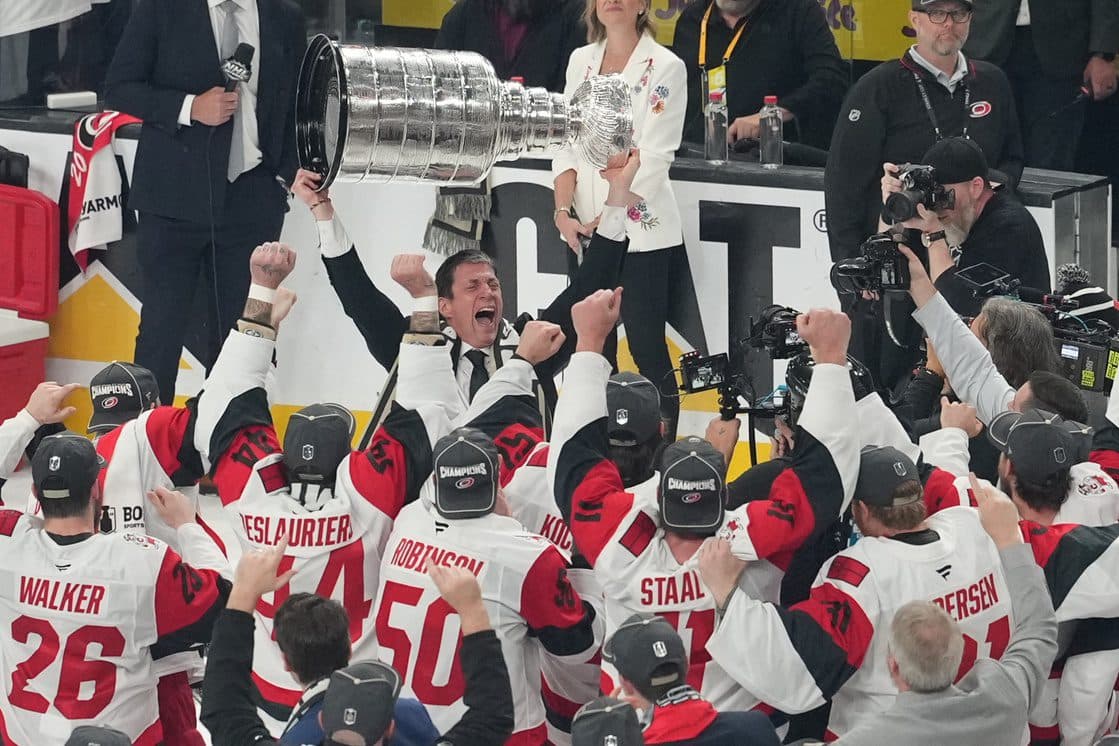 Carolina Hurricanes head coach Rod Brind'Amour celebrates holding the Stanley Cup after the win against the Vegas Golden Knights in game six of the 2026 Stanley Cup Final at T-Mobile Arena.