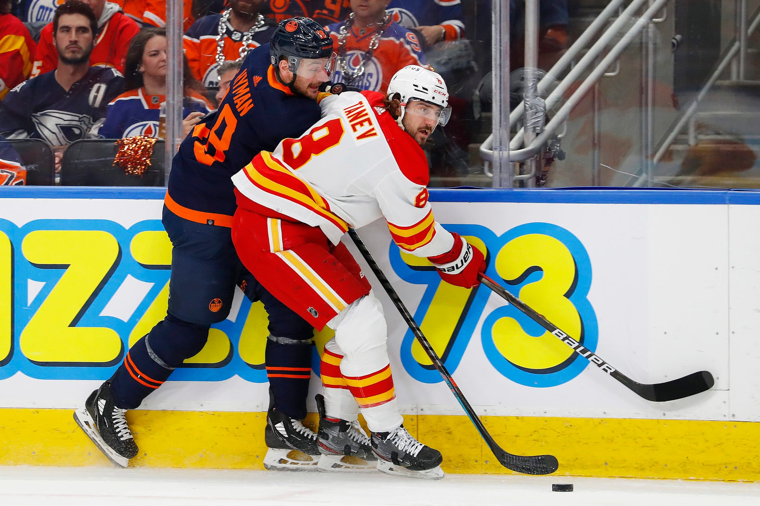 Flames’ Chris Tanev leaves game after taking puck to the head