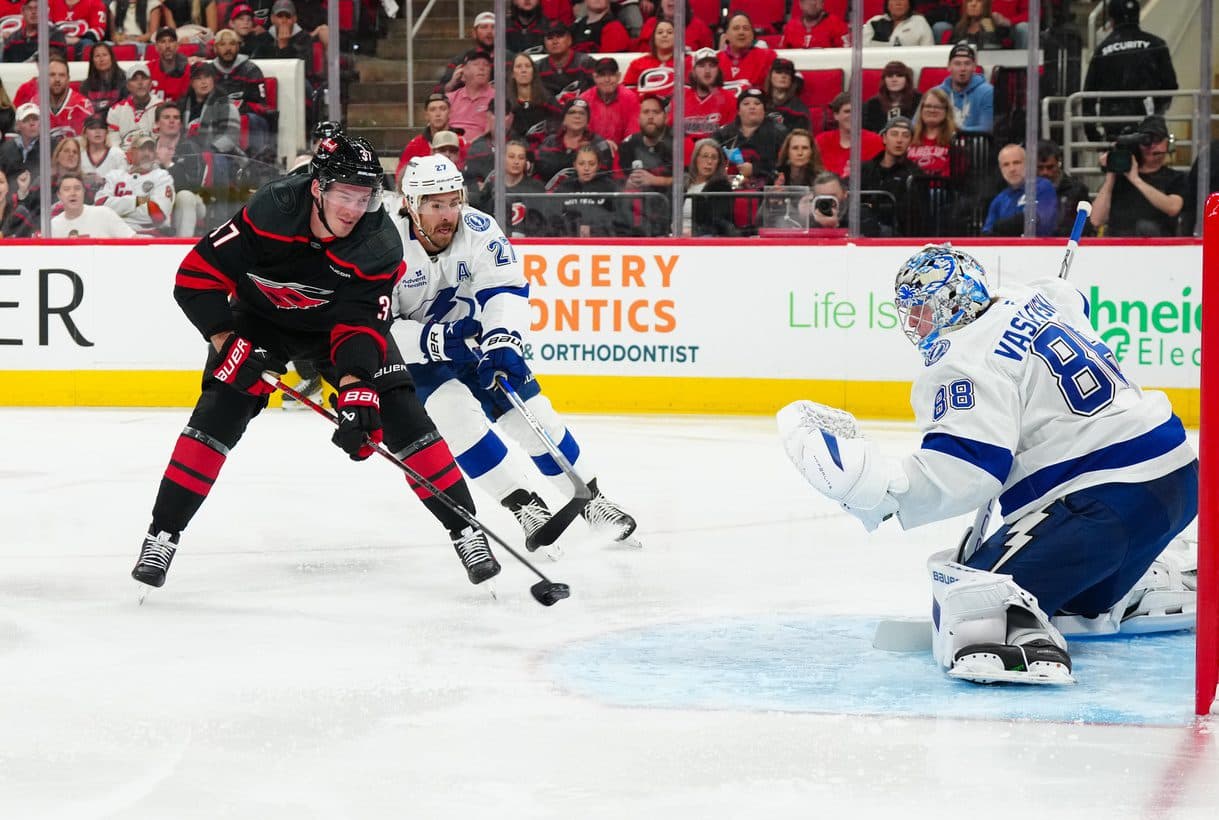 Carolina Hurricanes right wing Andrei Svechnikov (37) has a scoring attempt against Tampa Bay Lightning goaltender Andrei Vasilevskiy (88) and defenseman Ryan McDonagh (27) during the first period at PNC Arena.