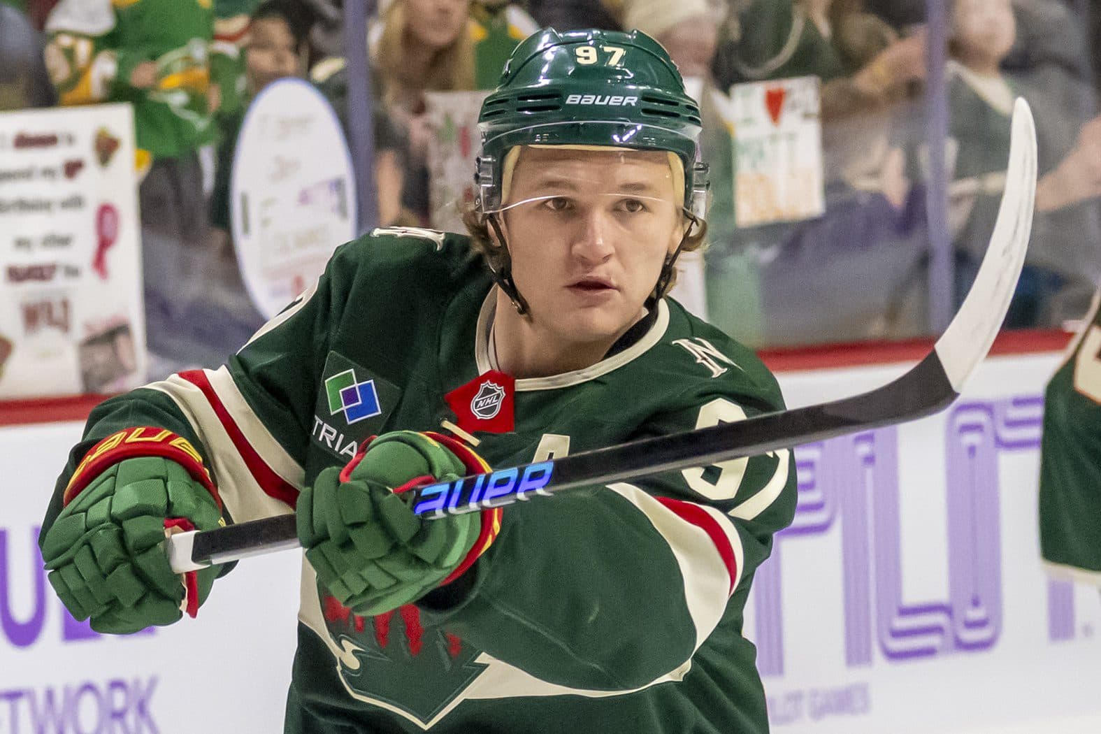 Minnesota Wild forward Kirill Kaprizov (97) shoots a puck during warm up before a game against the Winnipeg Jets at Xcel Energy Center.