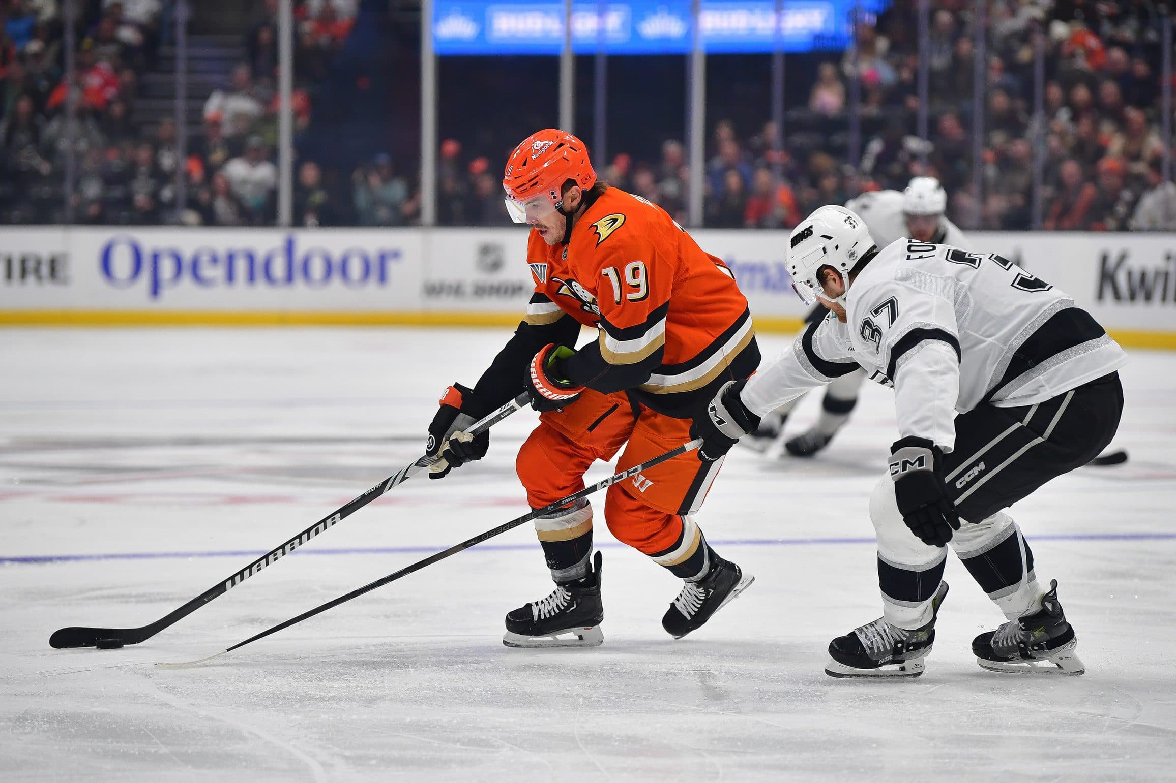 Anaheim Ducks right wing Troy Terry (19) moves the puck against Los Angeles Kings left wing Warren Foegele (37) during the second period at Honda Center.
