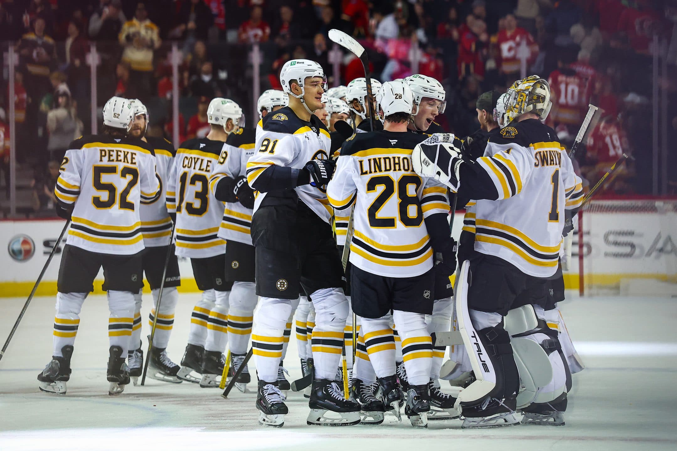 Boston Bruins players celebrates after defeating the Calgary Flames at Scotiabank Saddledome.