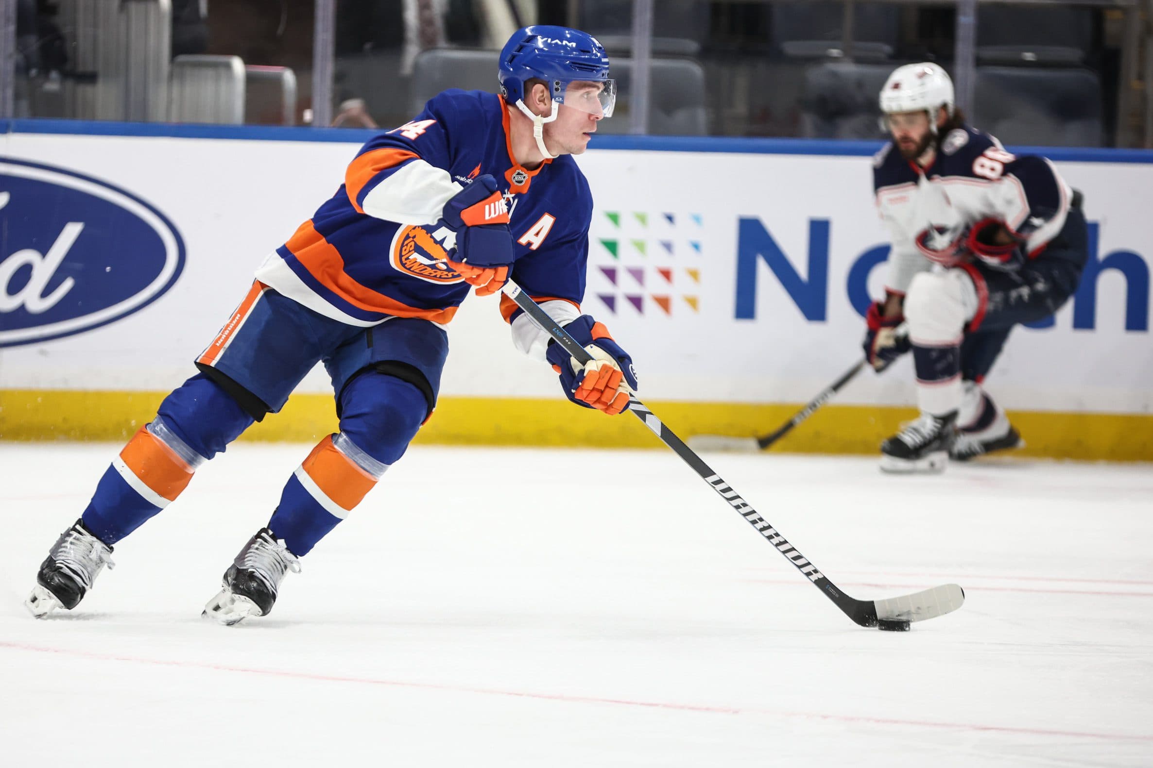 New York Islanders center Bo Horvat (14) controls the puck in the third period against the Columbus Blue Jackets at UBS Arena.
