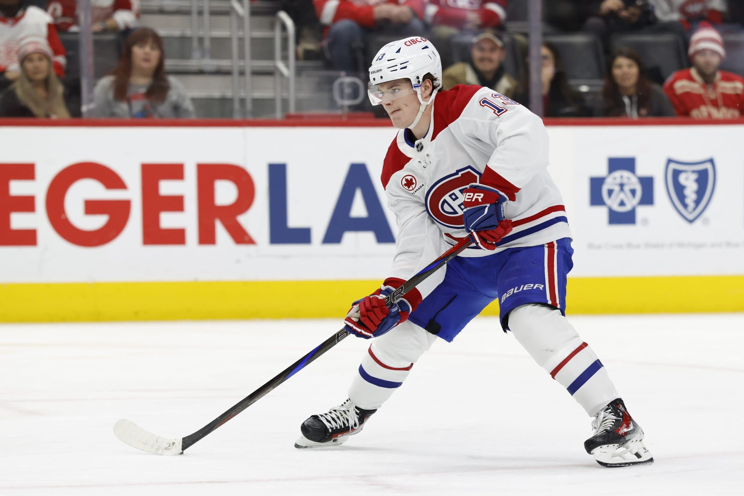 Montreal Canadiens right wing Cole Caufield (13) skates with the puck in the third period against the Detroit Red Wings at Little Caesars Arena.