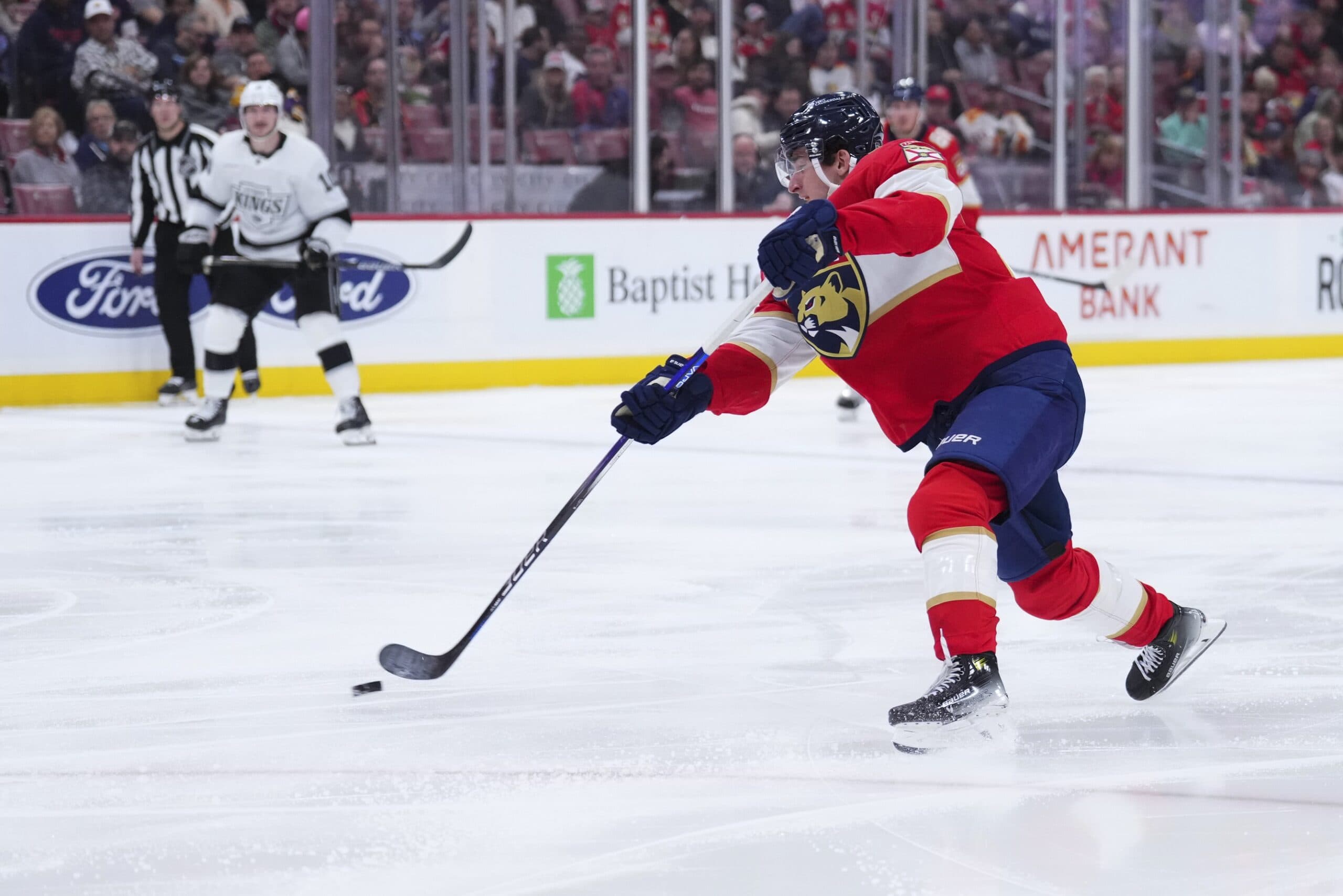 Florida Panthers right wing Mackie Samoskevich (25) shoots the puck against the Los Angeles Kings during the second period at Amerant Bank Arena.