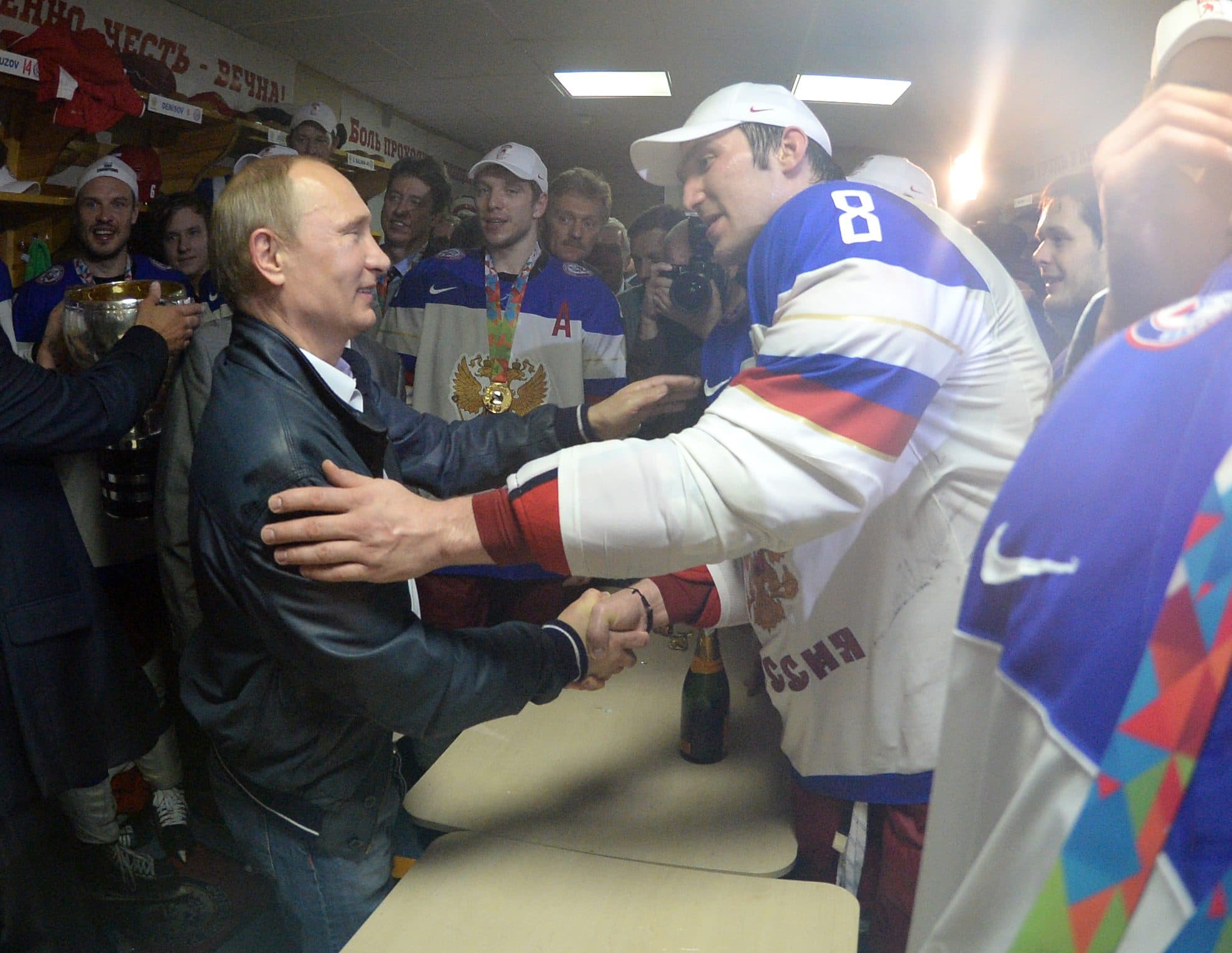 Russian President Vladimir Putin congratulates Alex Ovechkin on goal record
