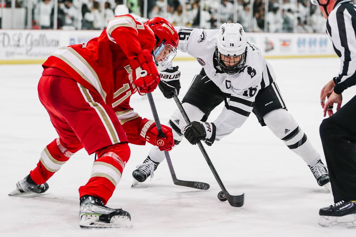 Western Michigan forward Tim Washe, Denver forward Samu Salminen