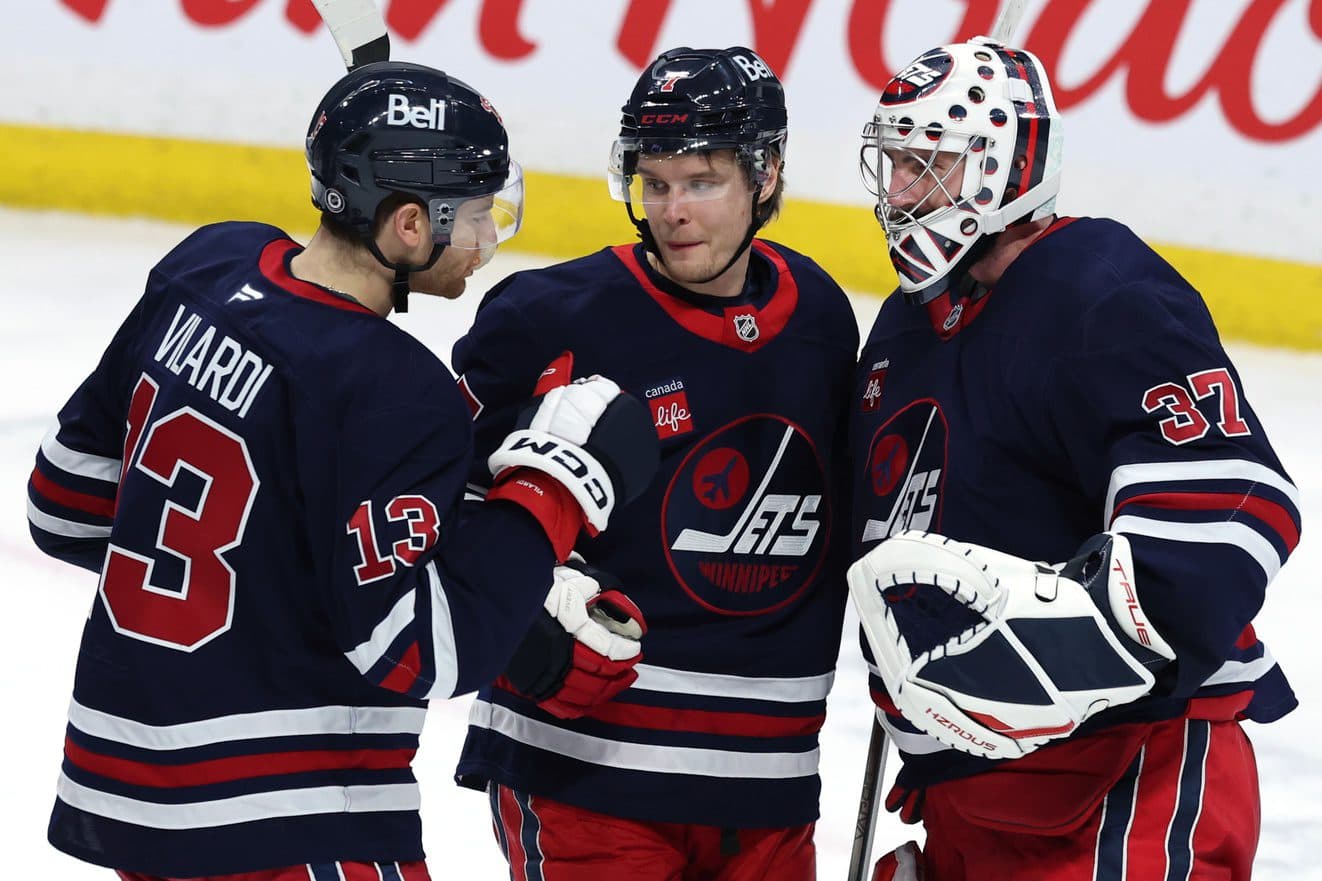 Winnipeg Jets center Gabriel Vilardi (13)m Winnipeg Jets center Vladislav Namestnikov (7) and Winnipeg Jets goaltender Connor Hellebuyck (37) celebrate their victory over the New York Islanders at Canada Life Centre.