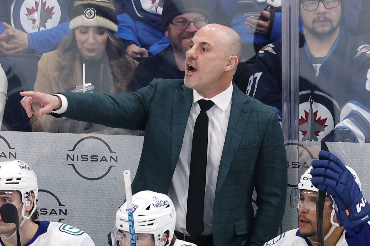 Rick Tocchet behind the bench