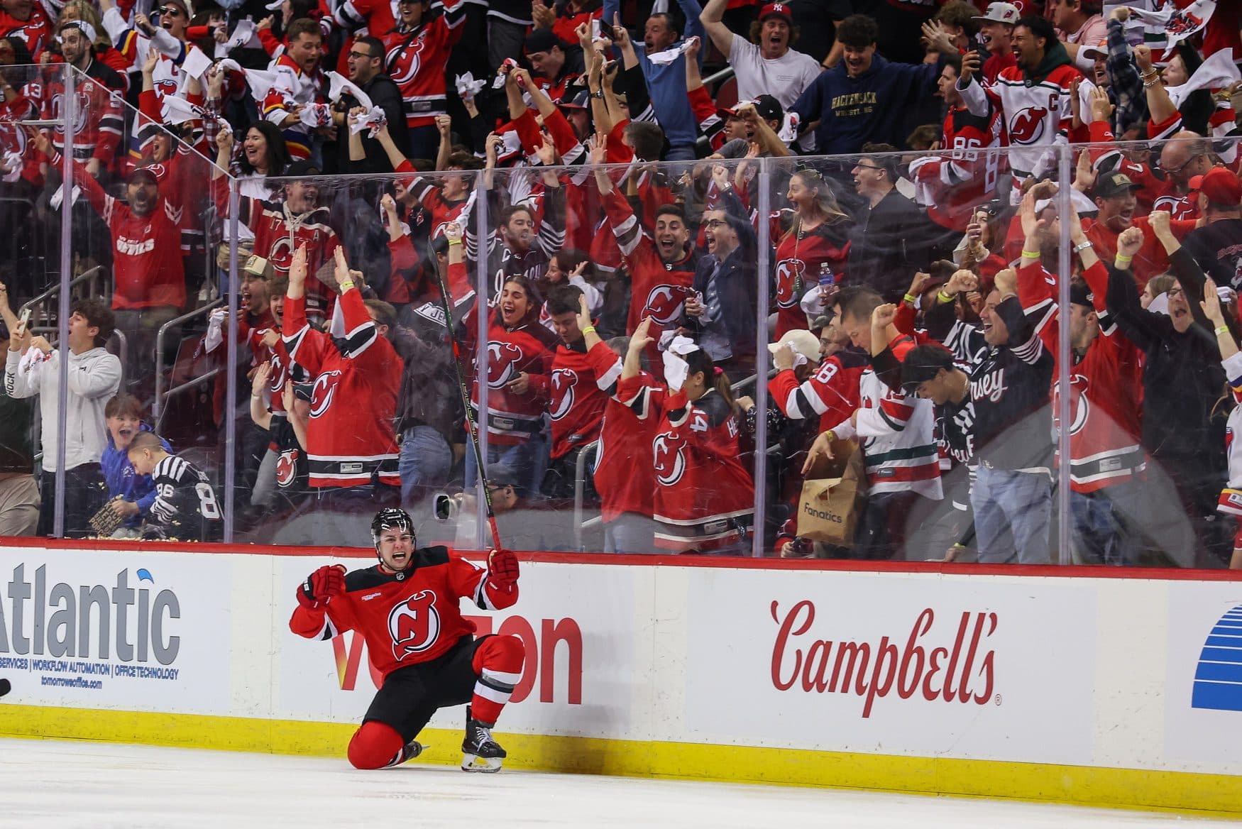 New Jersey Devils defenseman Simon Nemec (17) celebrates his game winning goal against the Carolina Hurricanes during the second overtime in game three of the first round of the 2025 Stanley Cup Playoffs at Prudential Center.