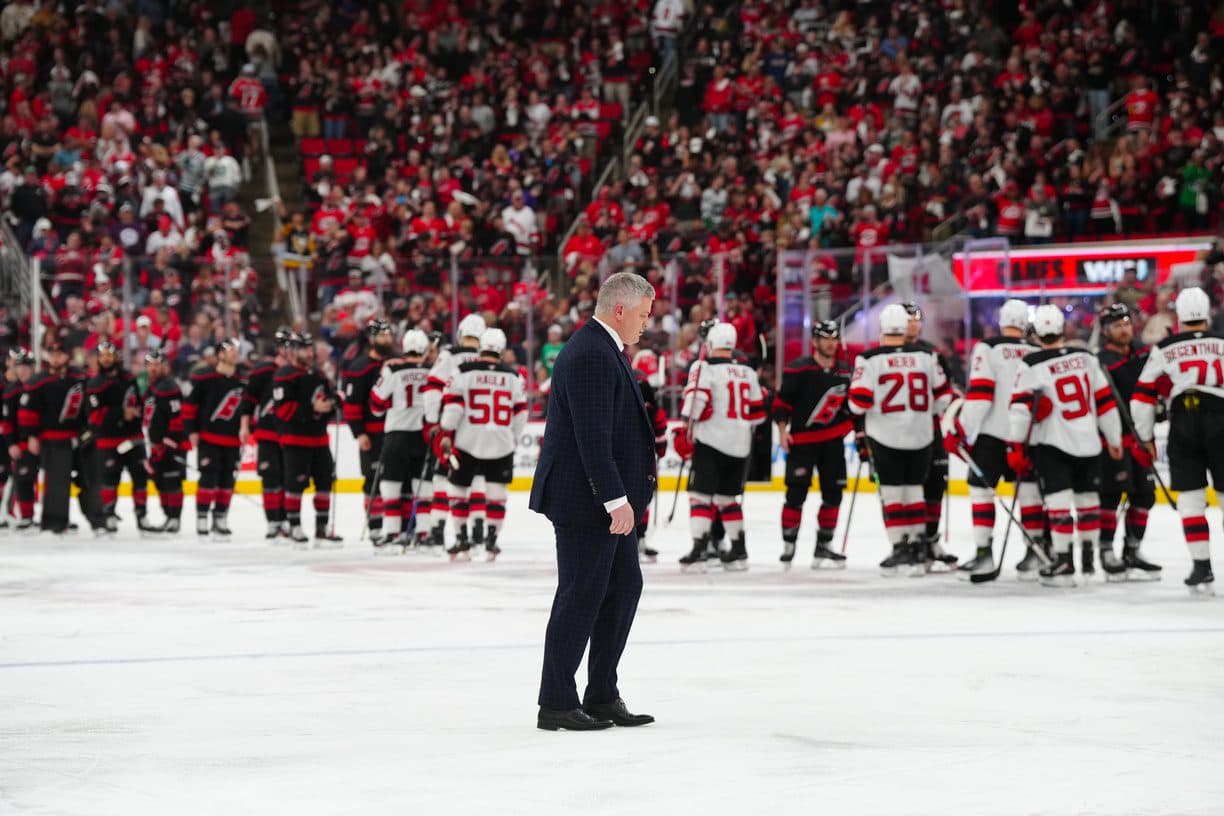 New Jersey Devils head coach Sheldon Keefe walks to the hand shake line after the loss to the Carolina Hurricanes in the second overtime in game five of the first round of the 2025 Stanley Cup Playoffs at Lenovo Center.