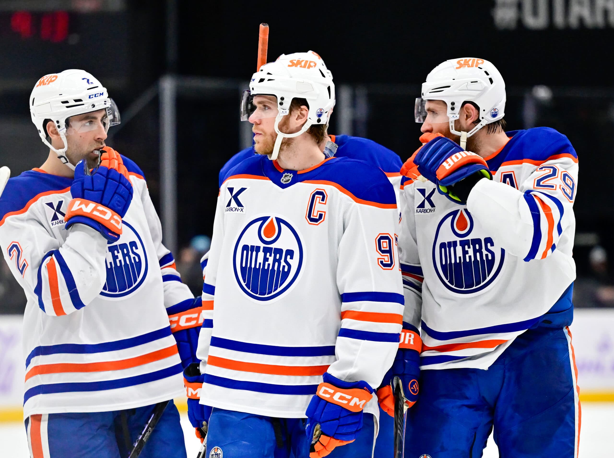 Evan Bouchard, Connor McDavid and Leon Draisaitl