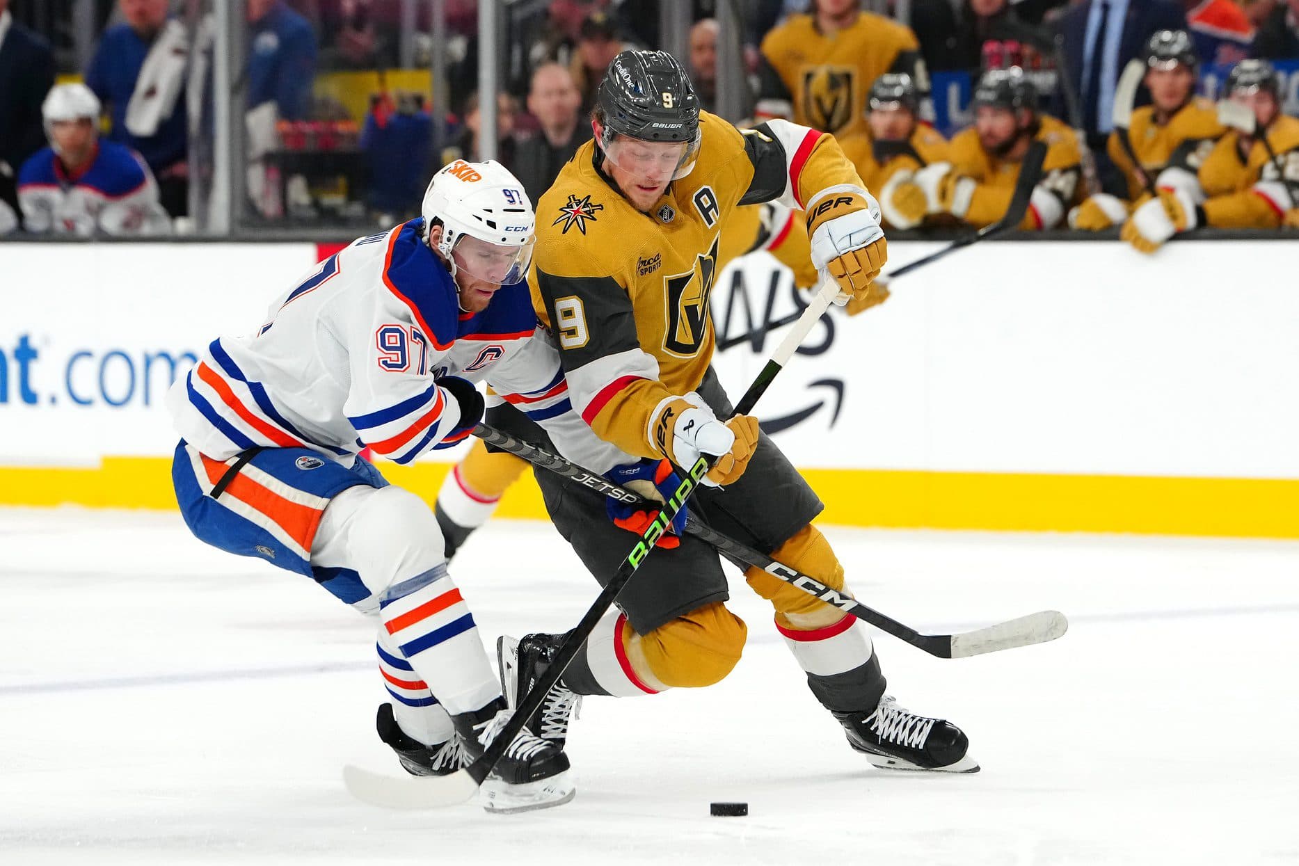 Edmonton Oilers center Connor McDavid (97) defends against Vegas Golden Knights center Jack Eichel (9) during the second period at T-Mobile Arena.
