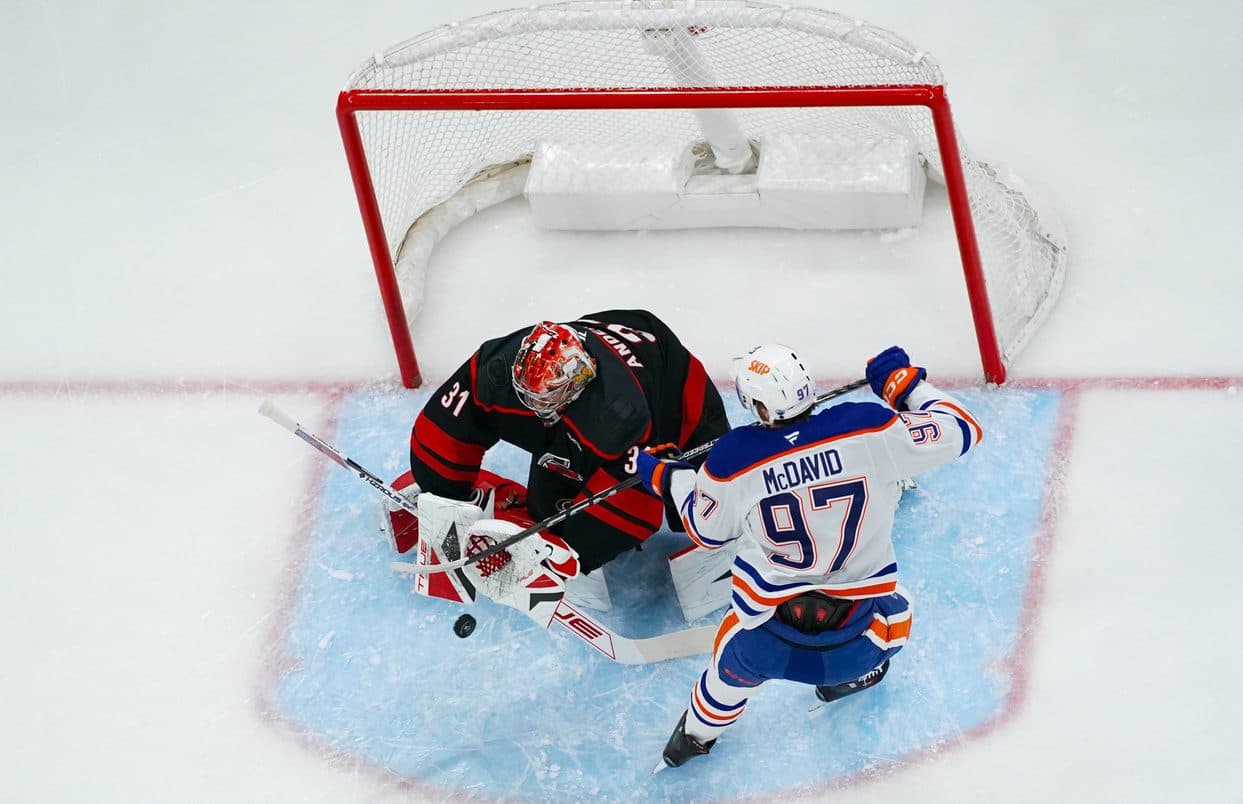 Carolina Hurricanes goaltender Frederik Andersen (31) stops the shot by Edmonton Oilers center Connor McDavid (97) during the first period at Lenovo Center.