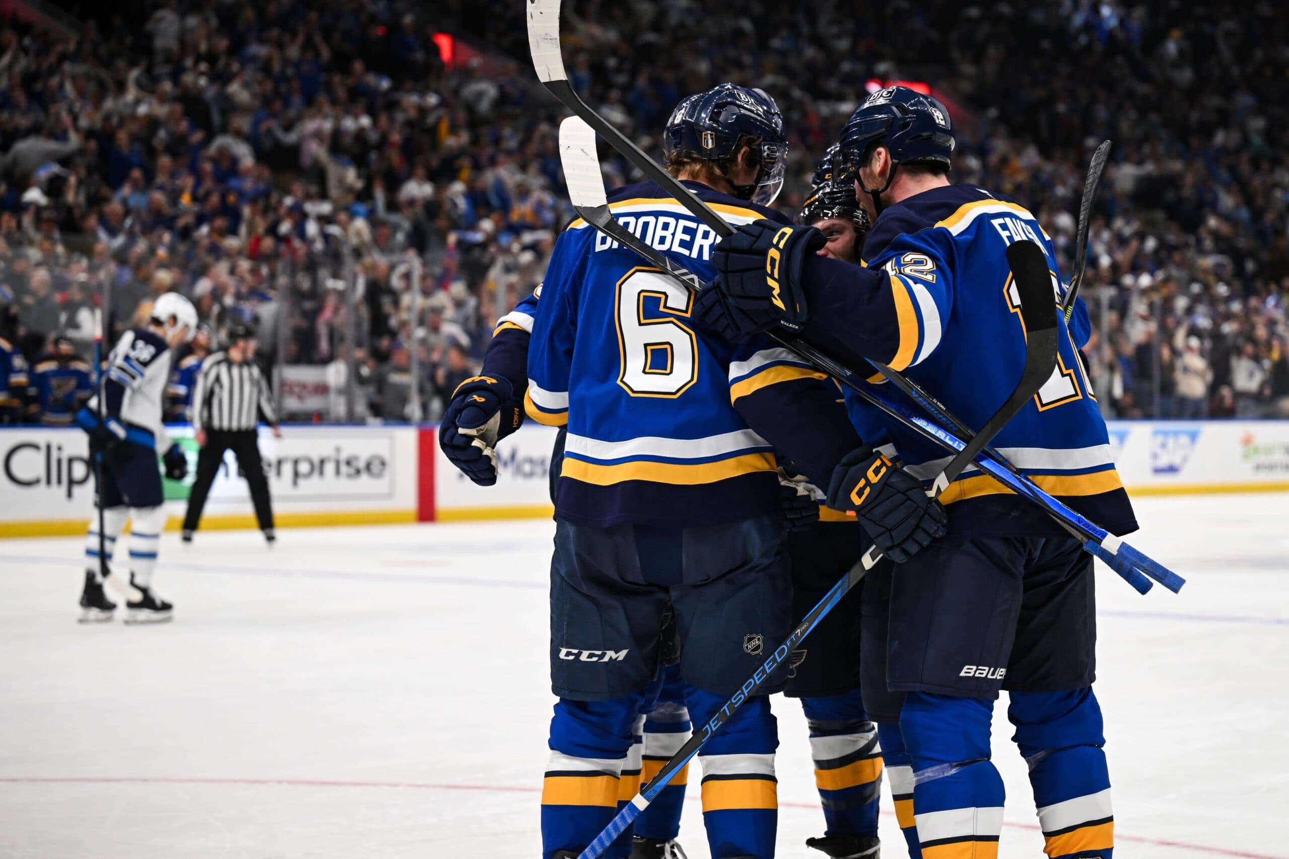 St. Louis Blues left wing Nathan Walker (26) celebrates with teammates after scoring a goal against the Winnipeg Jets during the second period in game six of the first round of the 2025 Stanley Cup Playoffs at Enterprise Center.