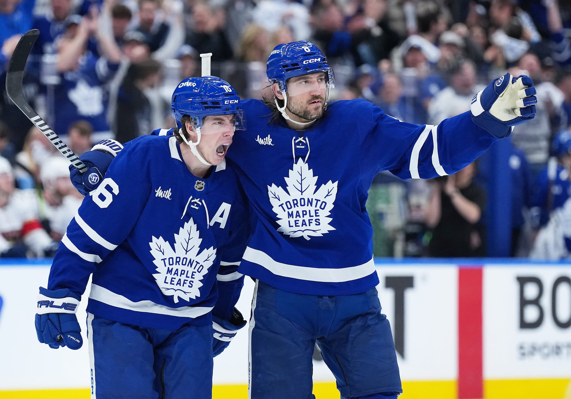 Toronto Maple Leafs right wing Mitch Marner (16) scores a goal and celebrates with defenseman Chris Tanev (8) against the Florida Panthers during the third period in game two of the second round of the 2025 Stanley Cup Playoffs at Scotiabank Arena.