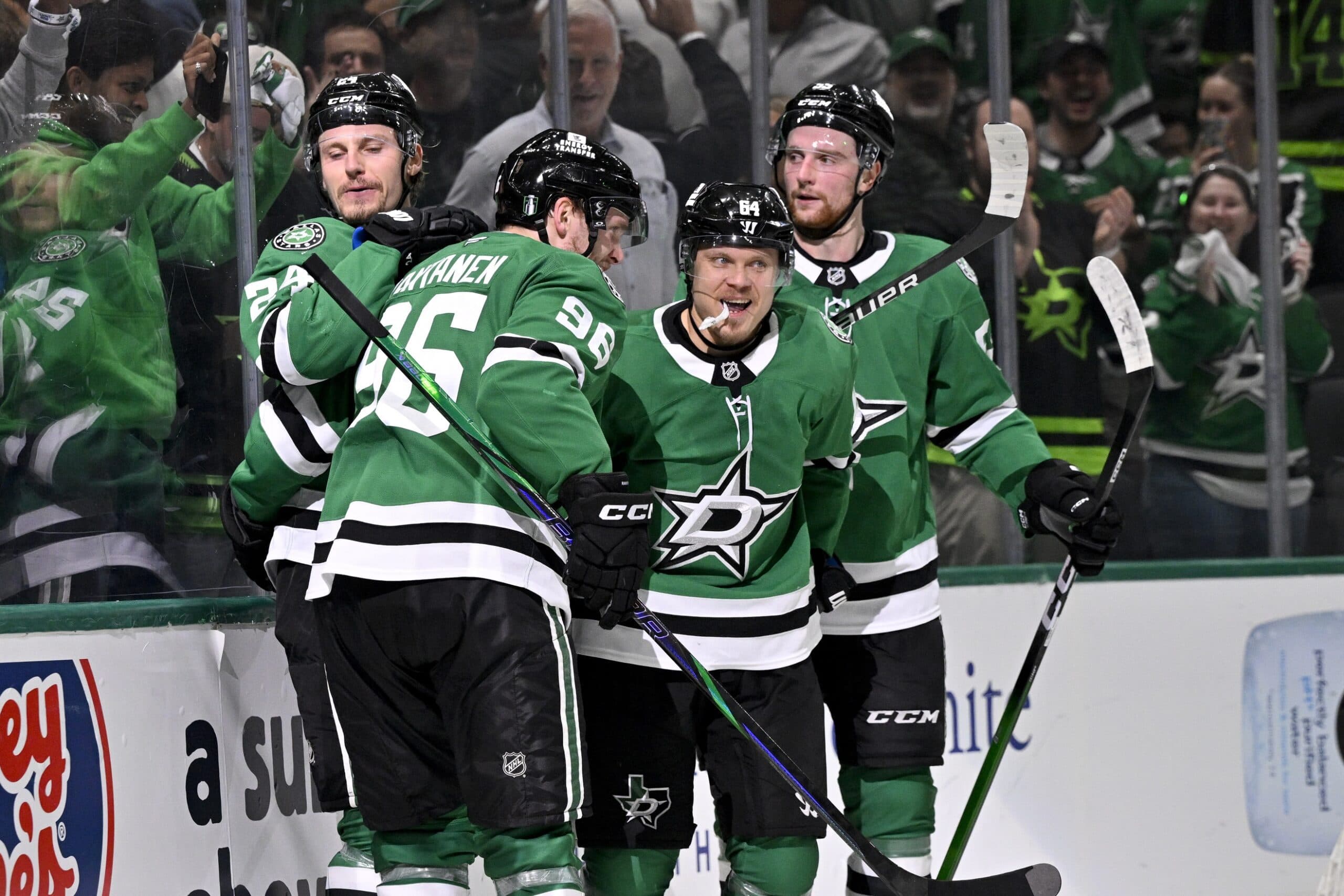 Dallas Stars right wing Mikko Rantanen (96) and center Roope Hintz (24) and center Mikael Granlund (64) and defenseman Thomas Harley (55) celebrates a goal scored by Granlund against the Winnipeg Jets during the second period in game four of the second round of the 2025 Stanley Cup Playoffs at American Airlines Center.