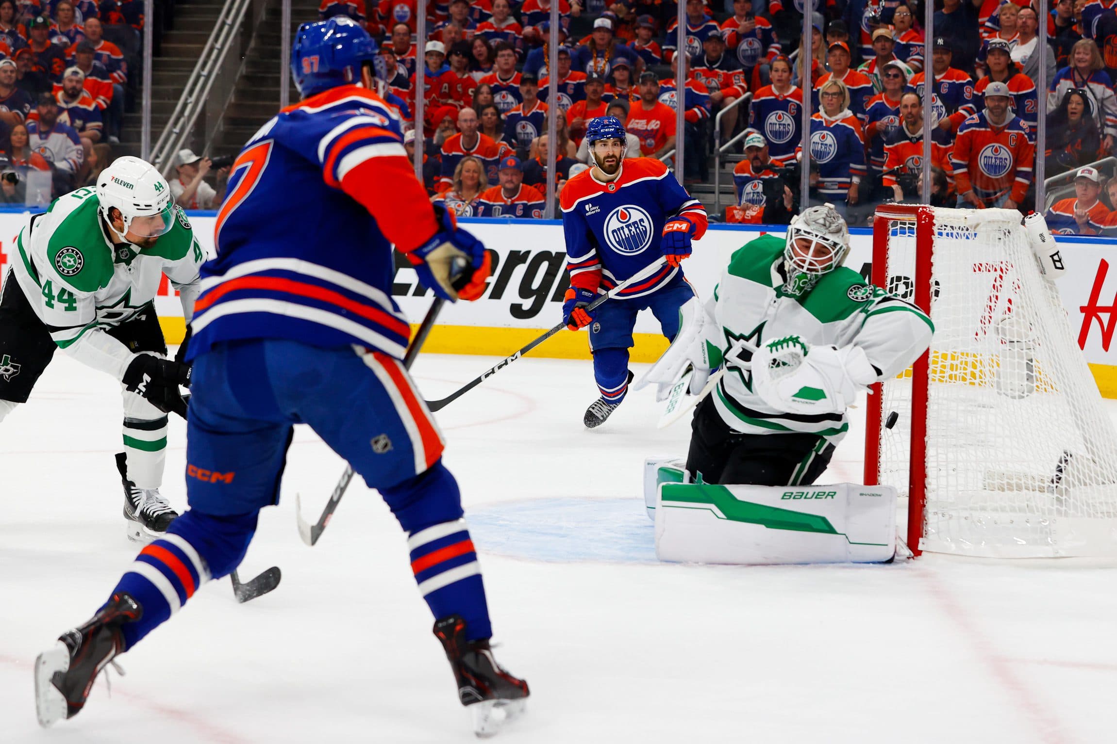 Edmonton Oilers center Connor McDavid (97) scores a goal against Dallas Stars goaltender Jake Oettinger (29) during the first period in game three of the Western Conference Final of the 2025 Stanley Cup Playoffs at Rogers Place.