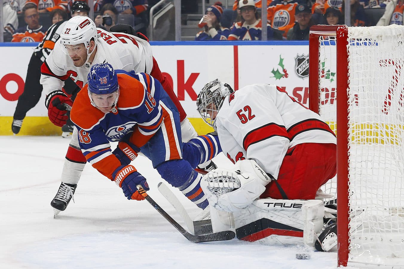 Edmonton Oilers forward Zach Hyman (18) scores a goal against Carolina Hurricanes goaltender Pyotr Kochetkov (52) during the first period at Rogers Place.