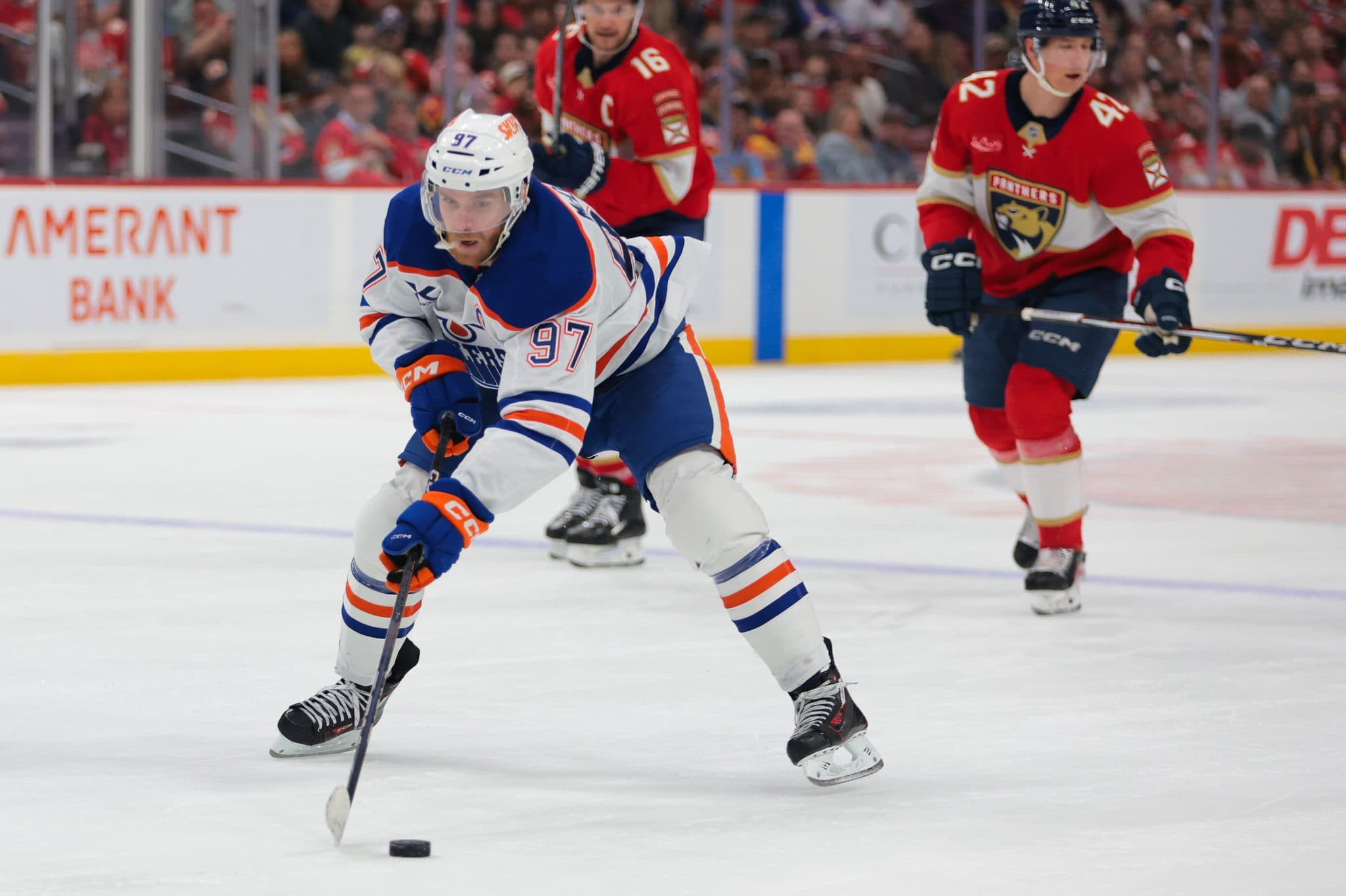 Edmonton Oilers center Connor McDavid (97) moves the puck against the Florida Panthers during the third period at Amerant Bank Arena.