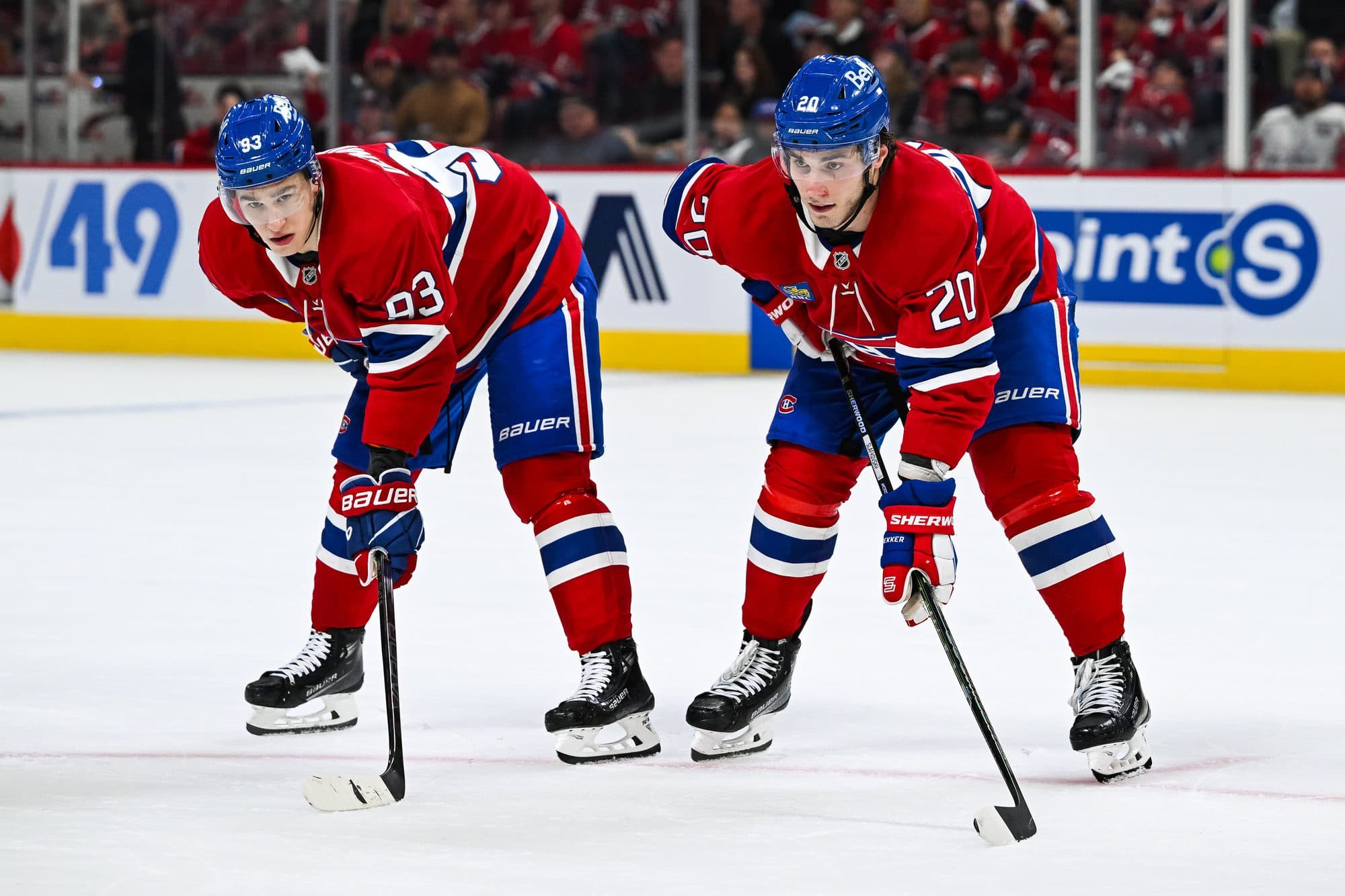 Montreal Canadiens right wing Ivan Demidov (93) and left wing Juraj Slafkovsky (20) wait for a face-off beside each other during the third period in game four of the first round of the 2025 Stanley Cup Playoffs at Bell Centre.