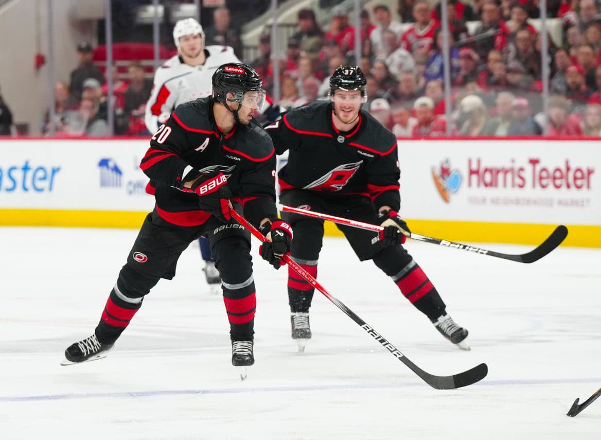 Carolina Hurricanes center Sebastian Aho (20) carries the puck with Carolina Hurricanes right wing Andrei Svechnikov (37) against the Washington Capitals during the third period in game four of the second round of the 2025 Stanley Cup Playoffs at Lenovo Center.