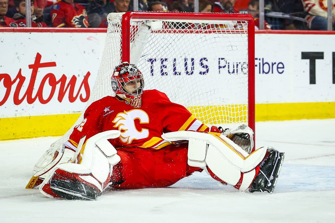 Calgary Flames goaltender Dustin Wolf (32) guards his net against the Vegas Golden Knights during the third period at Scotiabank Saddledome.