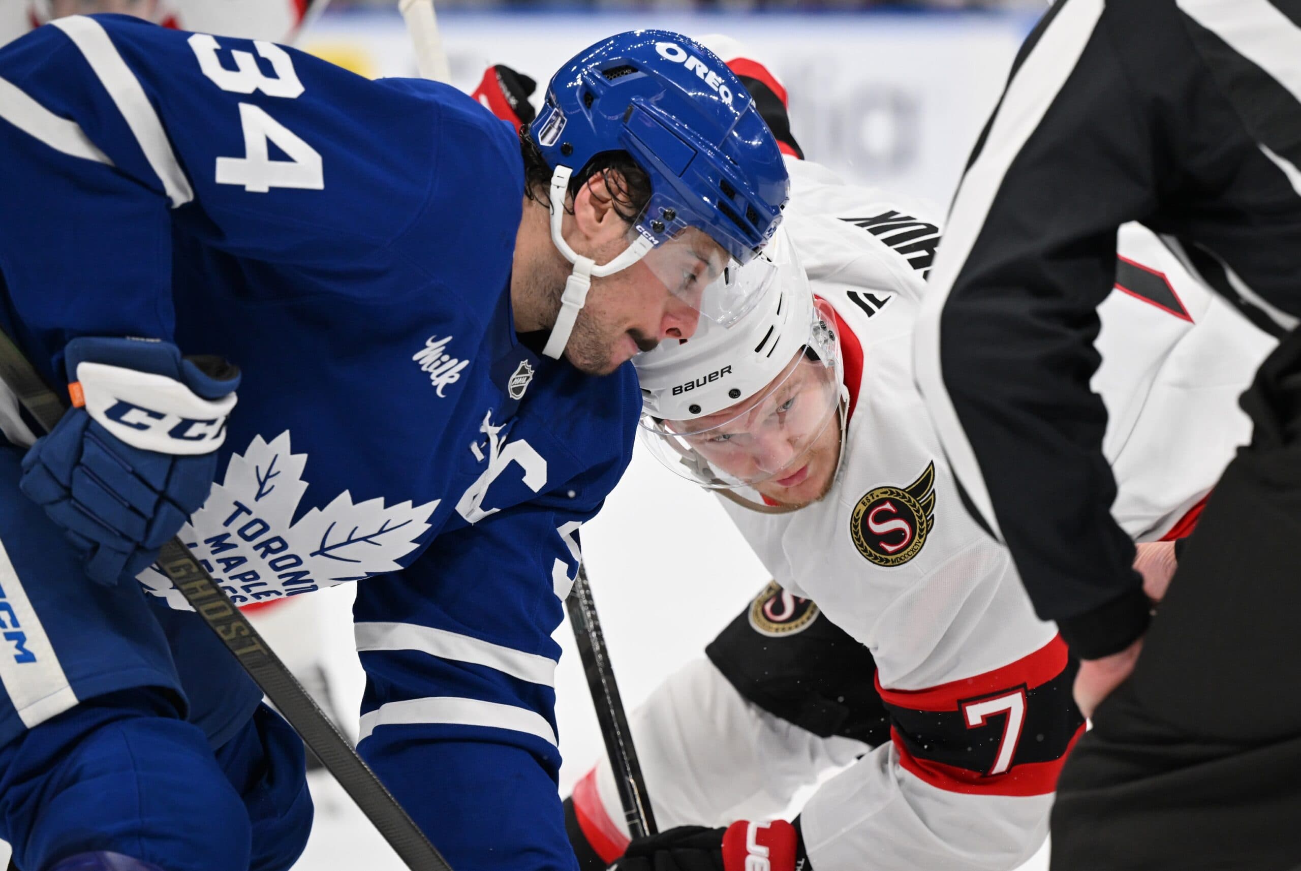 Toronto Maple Leafs forward Auston Matthews (34) and Ottawa Senators forward Brady Tkachuk (7) line up for a face off in the second period in game two of the first round of the 2025 Stanley Cup Playoffs at Scotiabank Arena.
