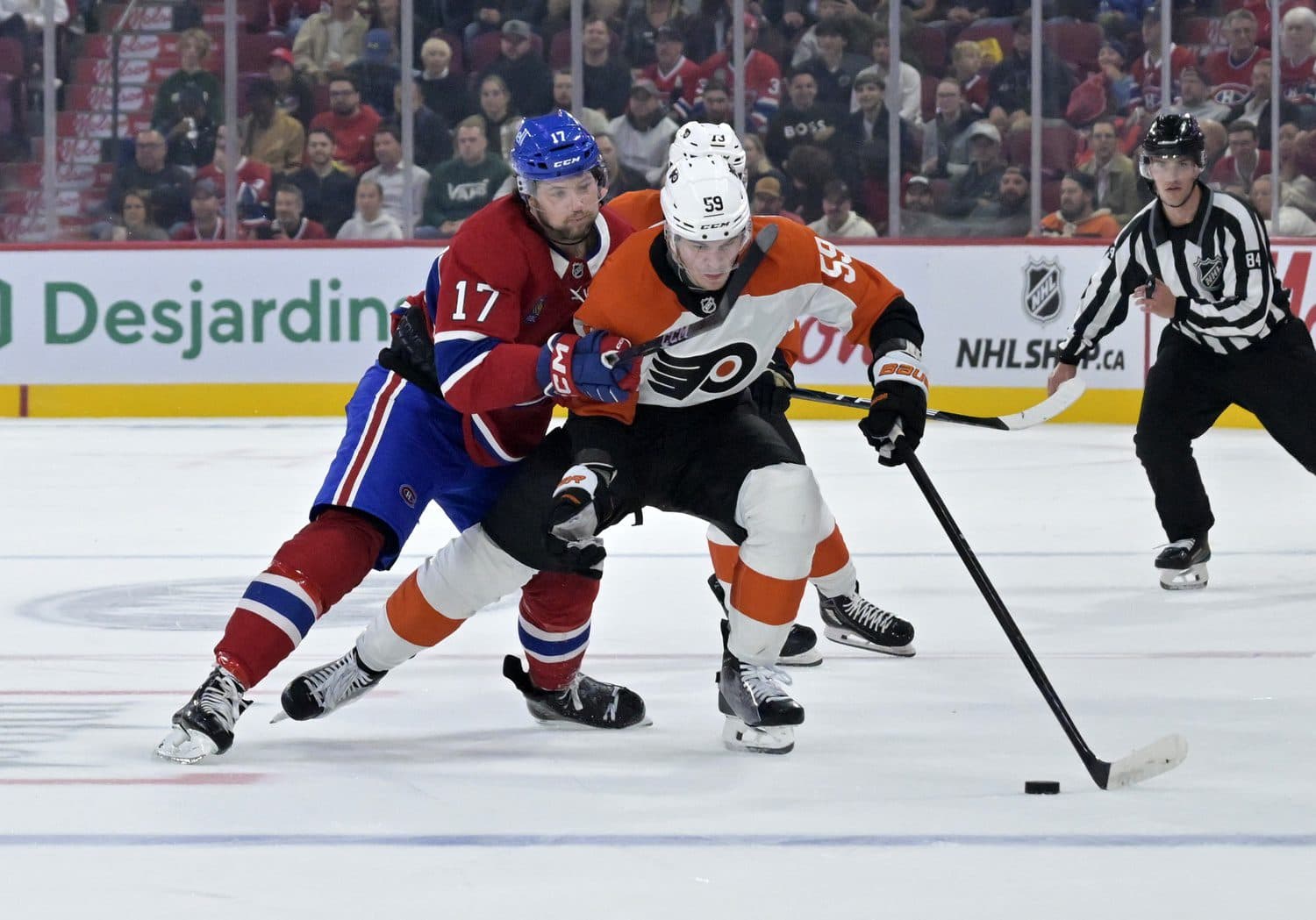Montreal Canadiens forward Josh Anderson (17) checks Philadelphia Flyers defenseman Oliver Bonk (59) during the third period at the Bell Centre.