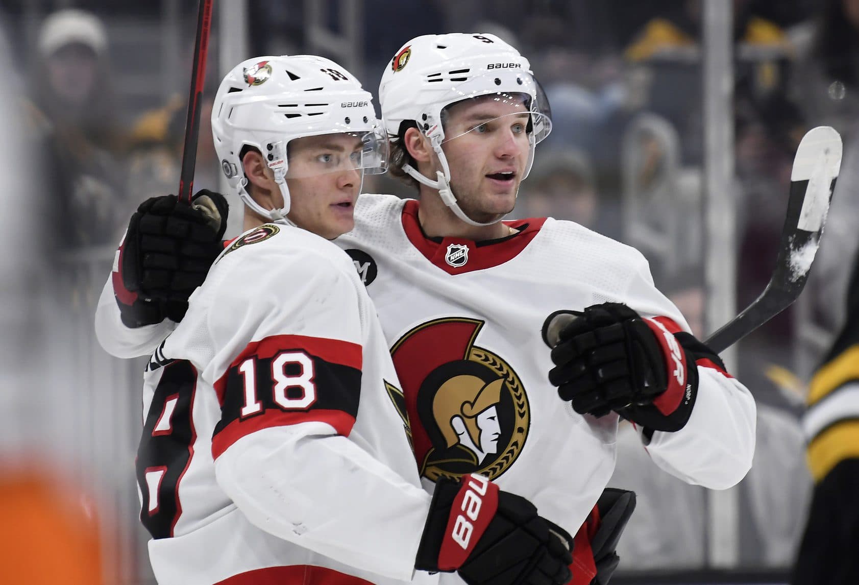 Ottawa Senators center Josh Norris (9) celebrates his goal with left wing Tim Stutzle (18) during the second period against the Boston Bruins at TD Garden.