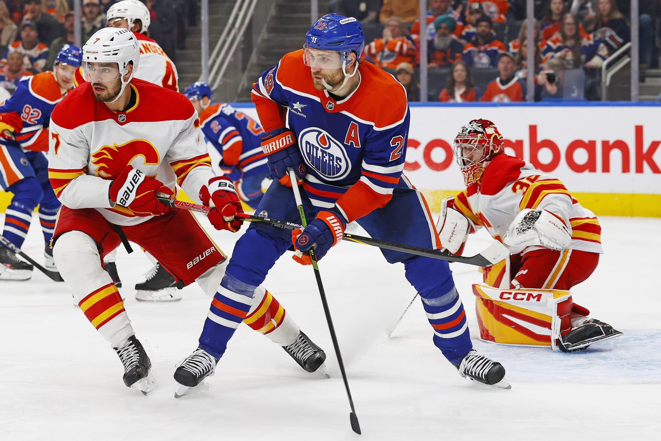 Edmonton Oilers forward Leon Draisaitl (29) battles for position with Calgary Flames defensemen Kevin Bahl (7) during the third period at Rogers Place.
