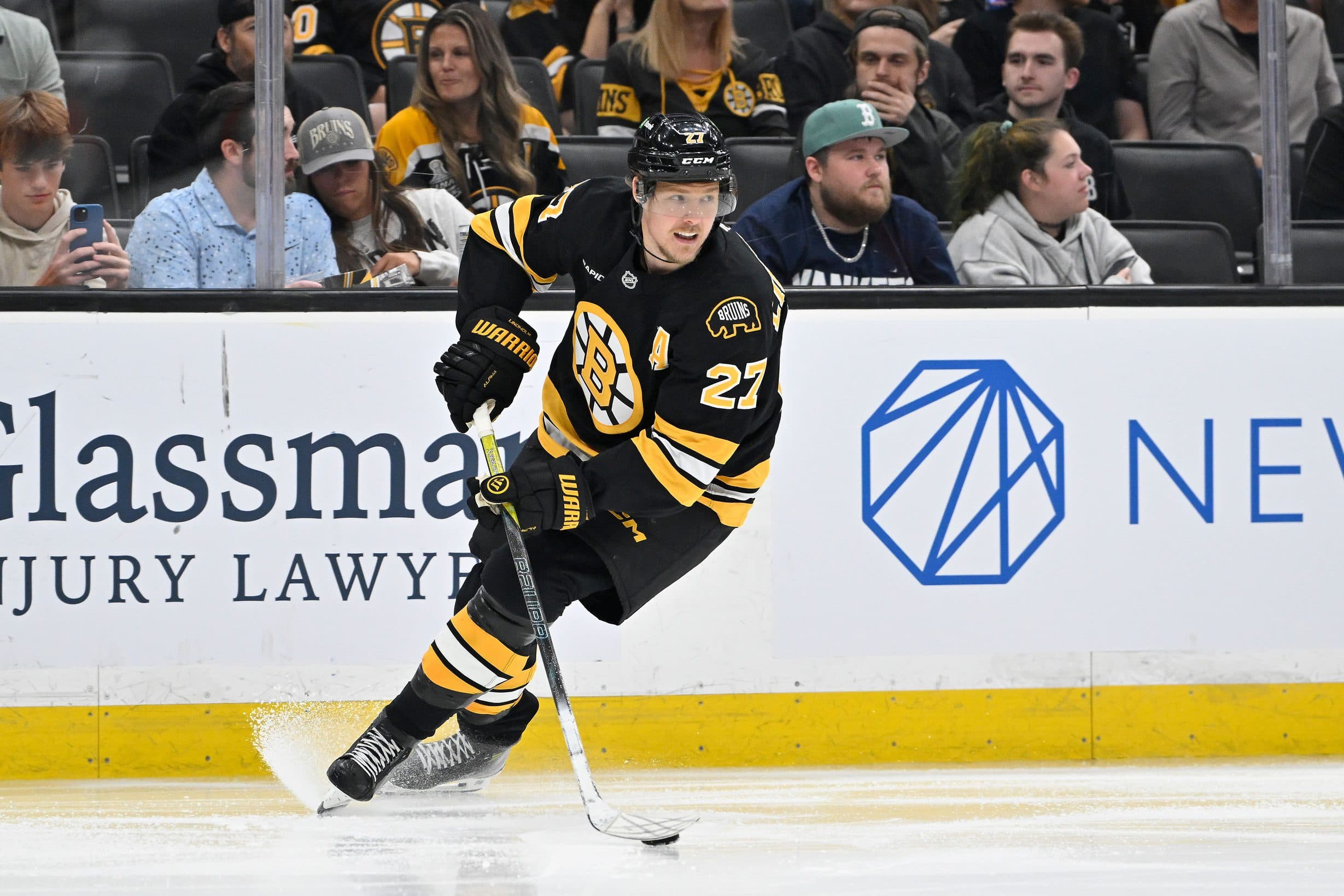 Boston Bruins defenseman Hampus Lindholm (27) with the puck during the second period against the Philadelphia Flyers at TD Garden.