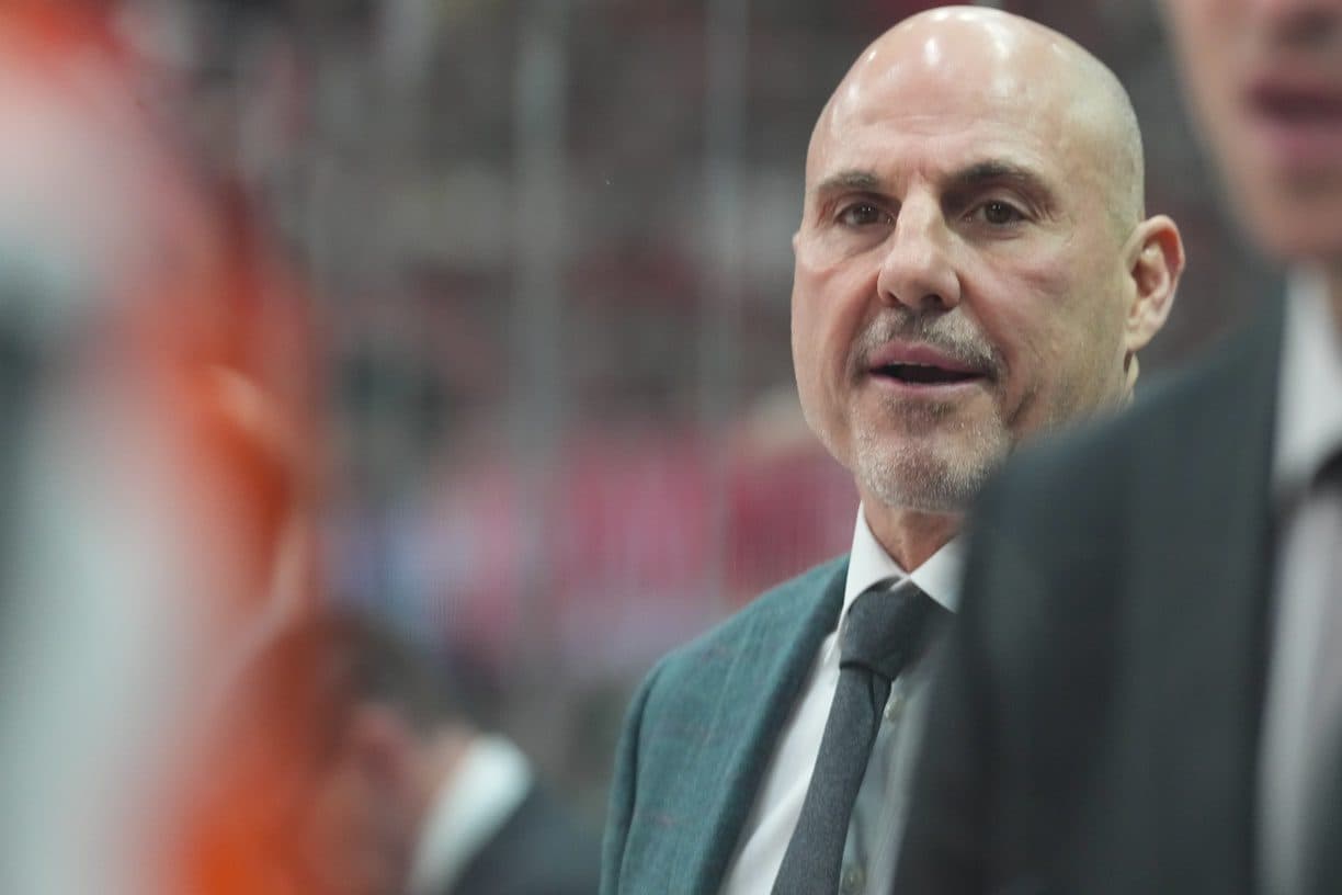 Philadelphia Flyers head coach Rick Tocchet looks on from behind the players bench against the Carolina Hurricanes during the first period at Lenovo Center.