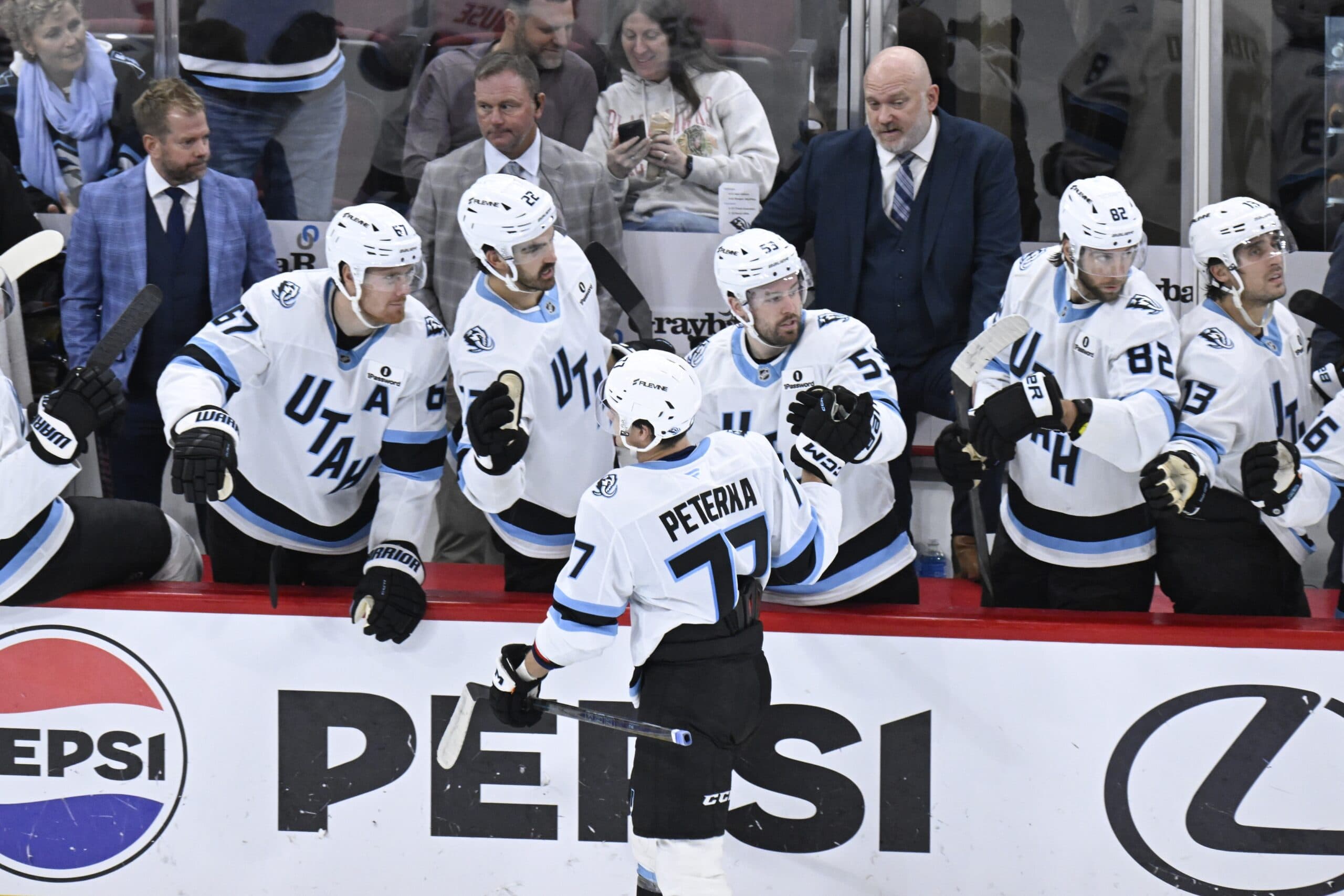 Utah Mammoth right wing JJ Peterka (77) celebrates with teammates after scoring a goal against the Chicago Blackhawks during the third period at United Center.