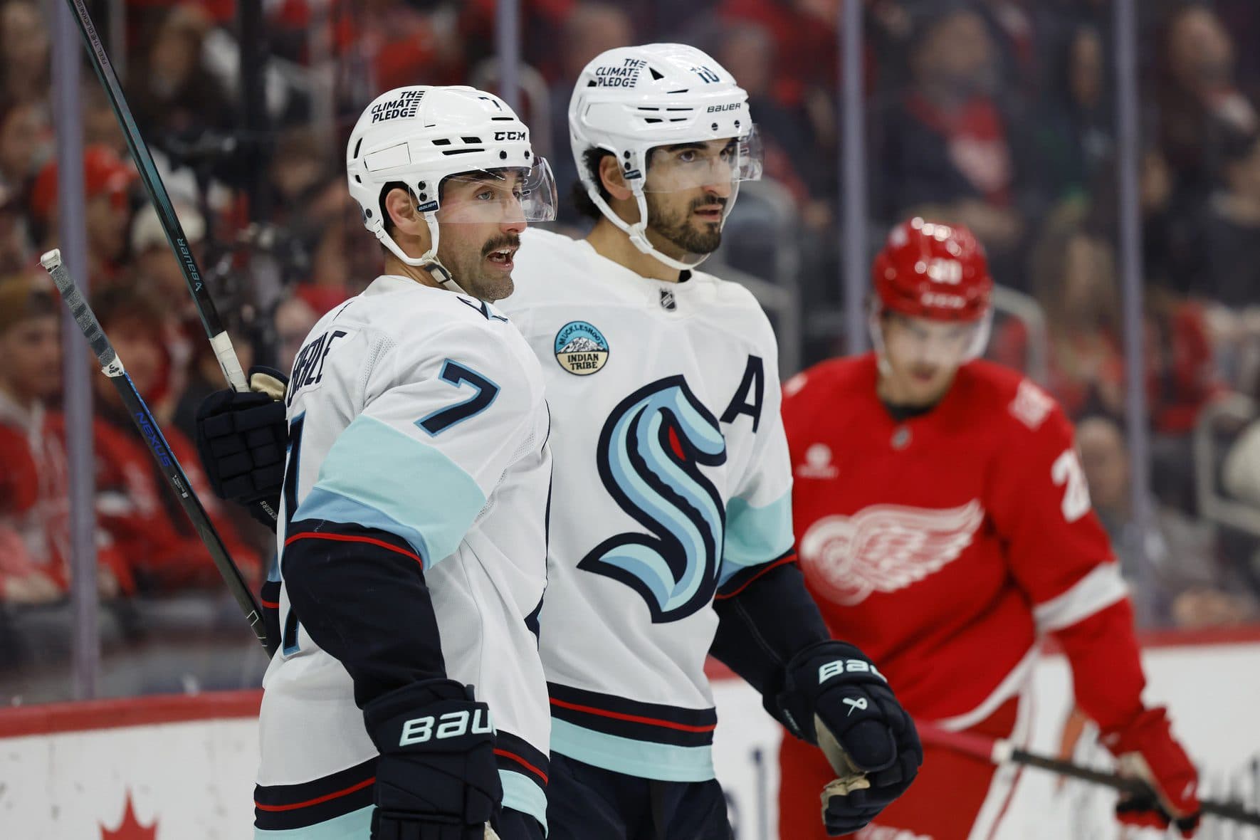 Seattle Kraken right wing Jordan Eberle (7) is congratulated by center Matty Beniers (10) after scoring in the first period against the Detroit Red Wings at Little Caesars Arena.