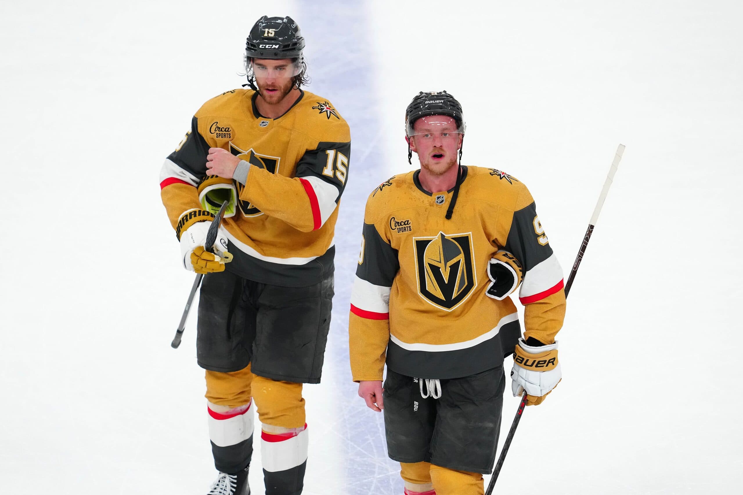 Vegas Golden Knights defenseman Noah Hanifin (15) and center Jack Eichel (9) leave the ice after the Edmonton Oilers defeated the Golden Knights 5-4 in overtime of game two of the second round of the 2025 Stanley Cup Playoffs at T-Mobile Arena.