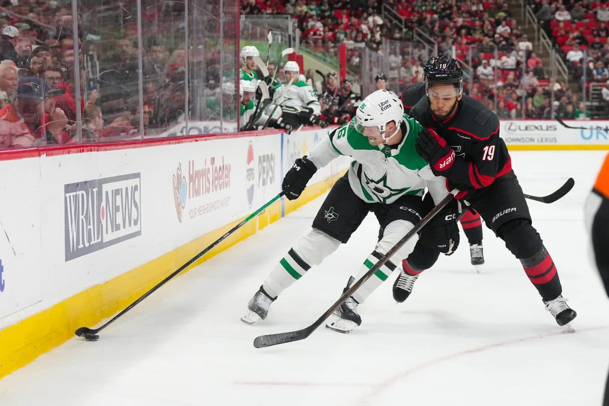Carolina Hurricanes defenseman K'andre Miller (19) checks Dallas Stars right wing Mikko Rantanen (96) during the second period at Lenovo Center.