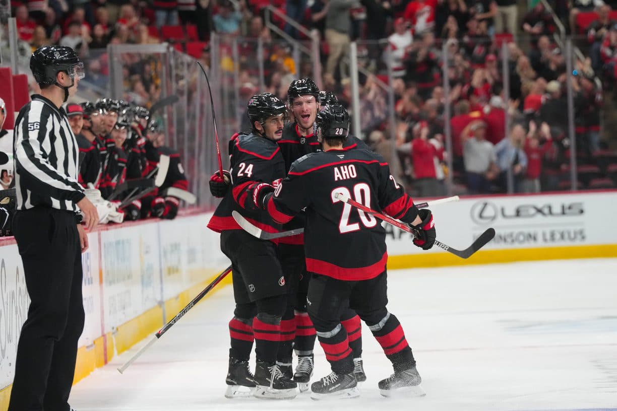 Carolina Hurricanes center Seth Jarvis (24) celebrates his goal with right wing Andrei Svechnikov (37) and center Sebastian Aho (20) goal against the Pittsburgh Penguins during the third period at Lenovo Center.