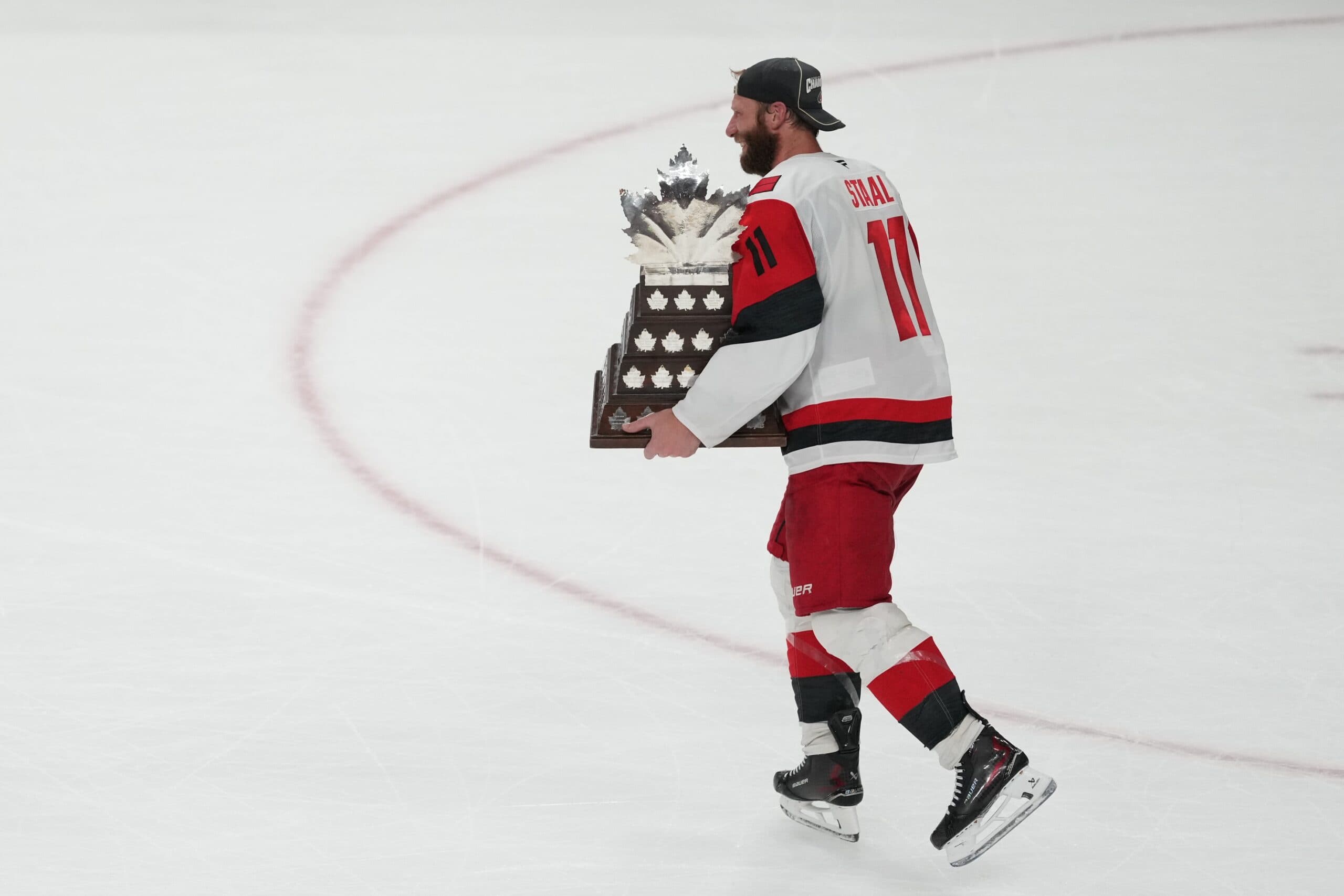 Carolina Hurricanes center Jordan Staal (11) is awarded the the Conn Smythe Trophy by Commisioner of the NHL Gary Bettman after the win against the Vegas Golden Knights in game six of the 2026 Stanley Cup Final at T-Mobile Arena.